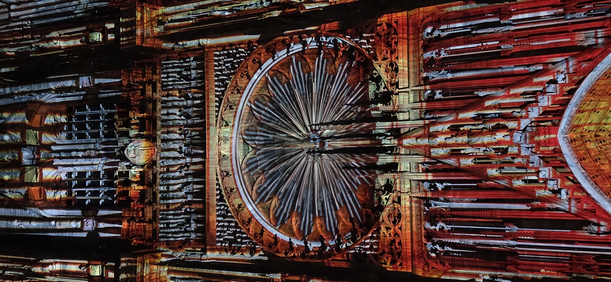 Projection mapping lights up a Gothic cathedral for a nighttime crowd