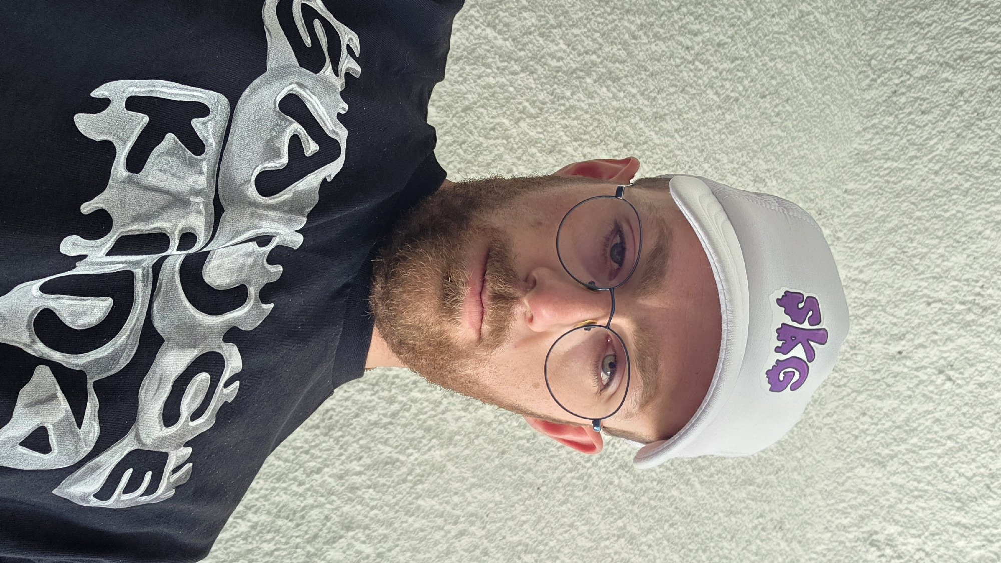 Quick stop in Razlog with silver Golf and SKG hat portraits