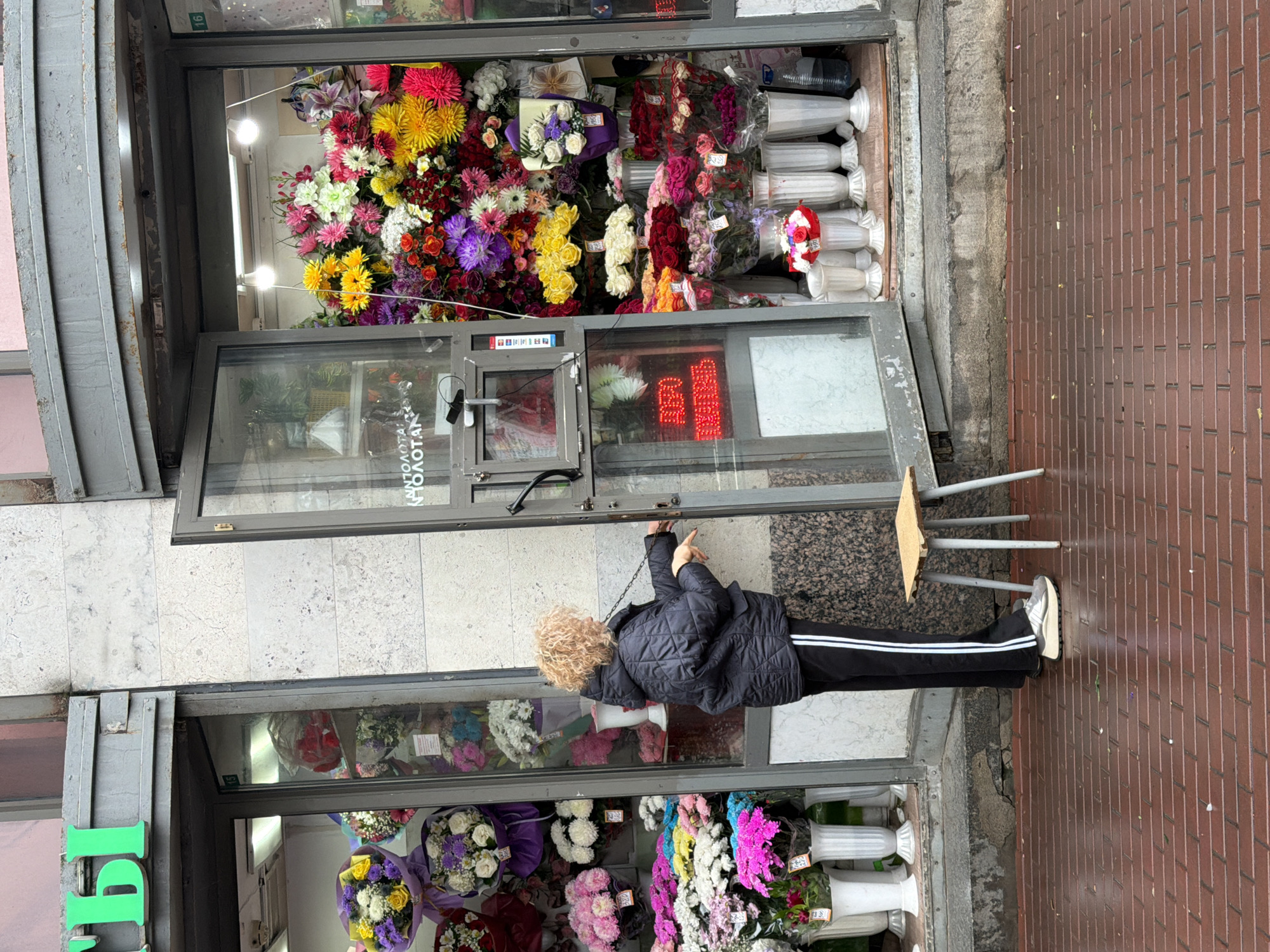 Woman observed at Saint Petersburg flower shop early morning