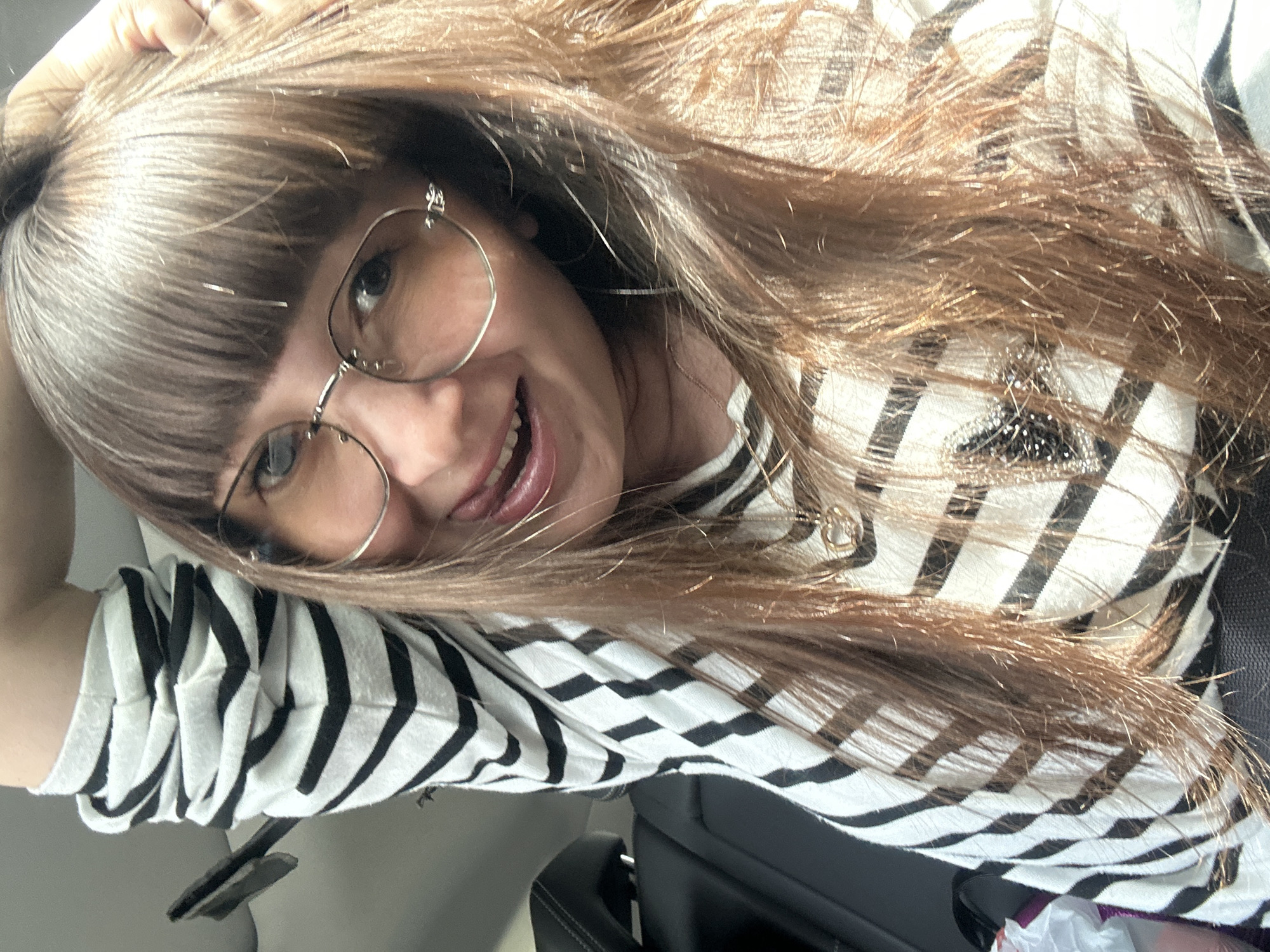 Woman takes selfies in car in Doksha, Russia