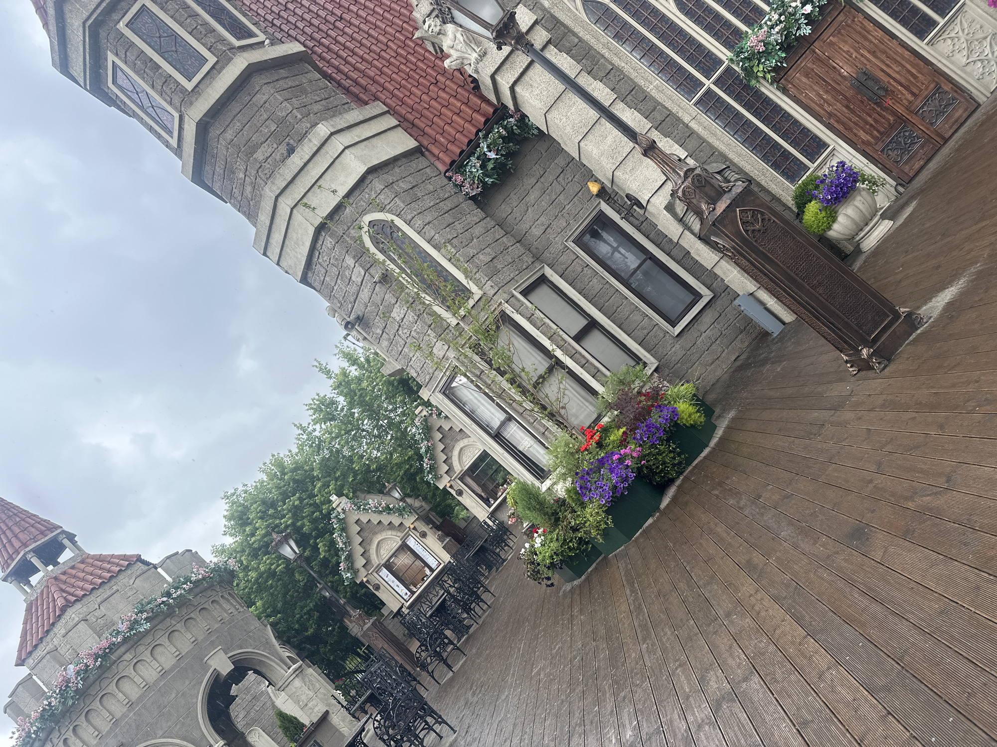 Medieval-themed Moscow venue after rain, castle architecture and carousel