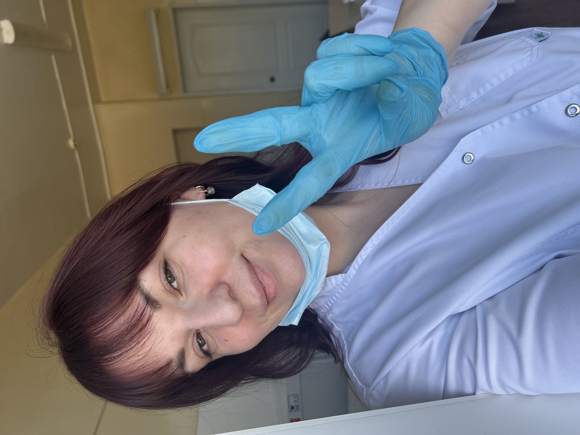 Healthcare worker documents workday in Russian medical facility