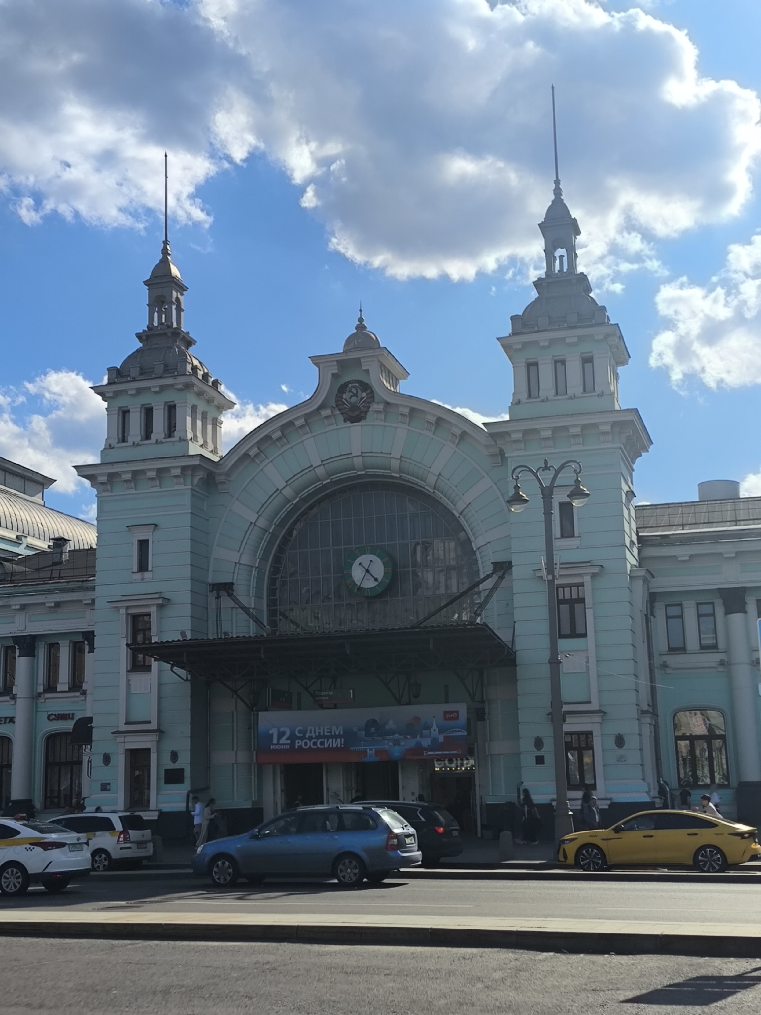 Traveler documents train journey through urban landscapes June 2026