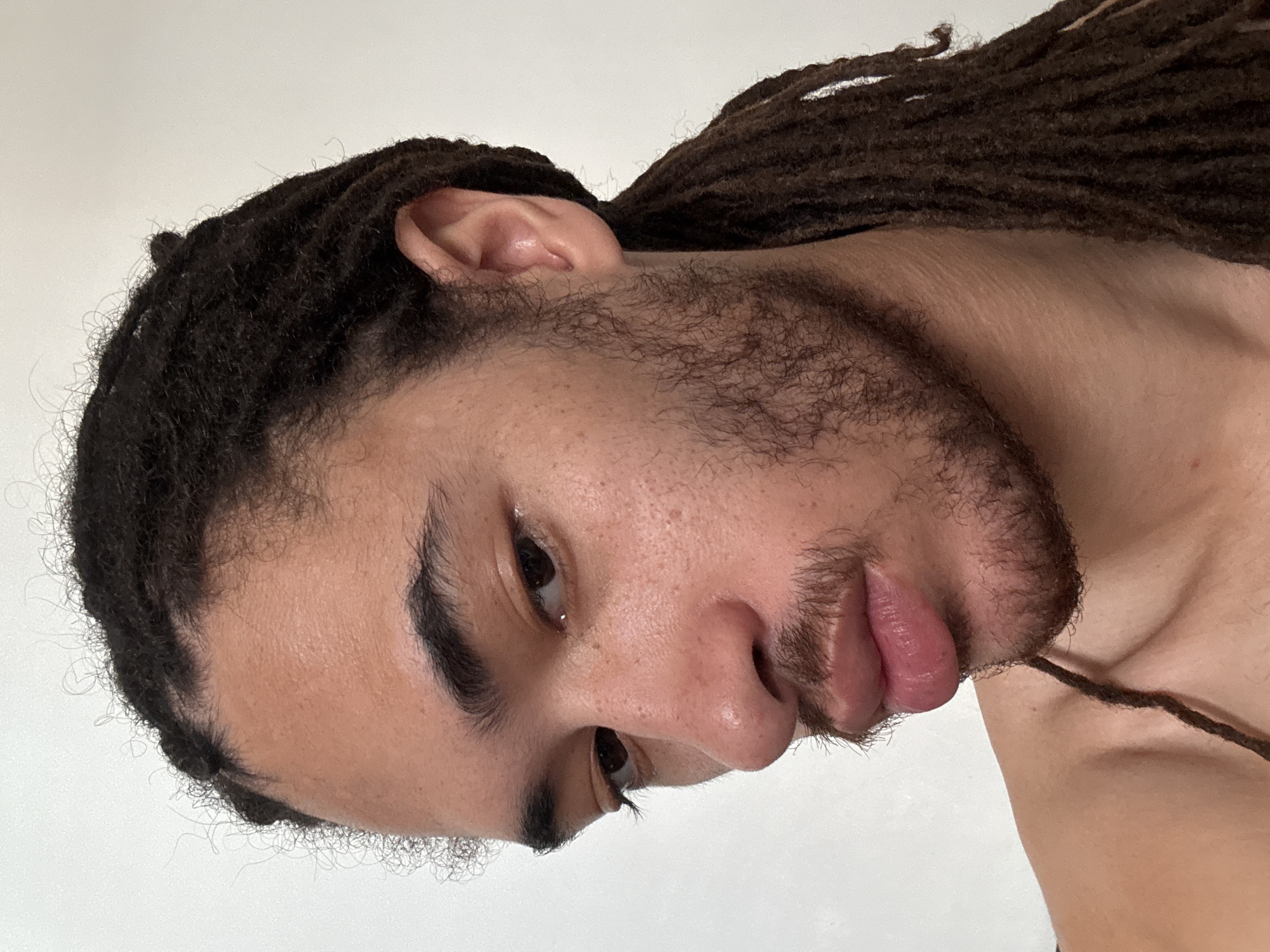 Close-up portrait with dreadlocks, shot twice in Paris