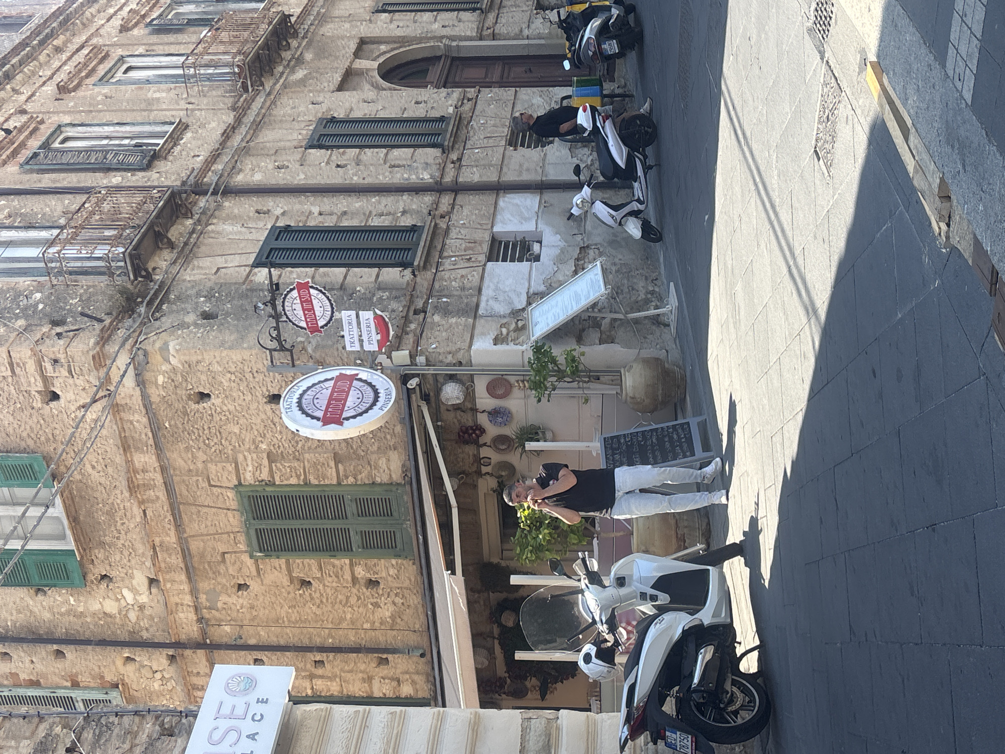 Sunny morning wander through Tropea's streets, cafes, and shop windows