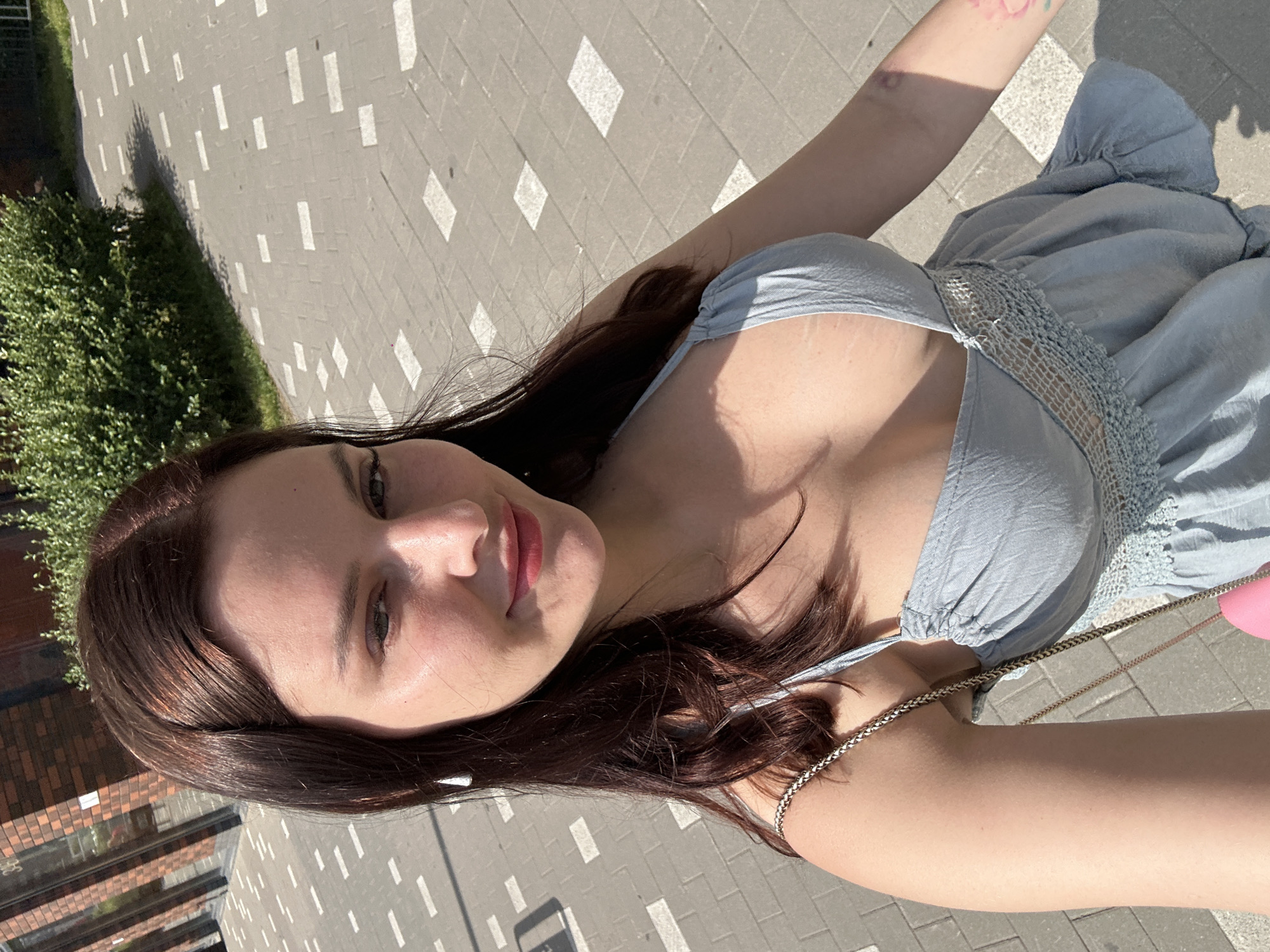 Selfie session near a patio with a yellow bike nearby