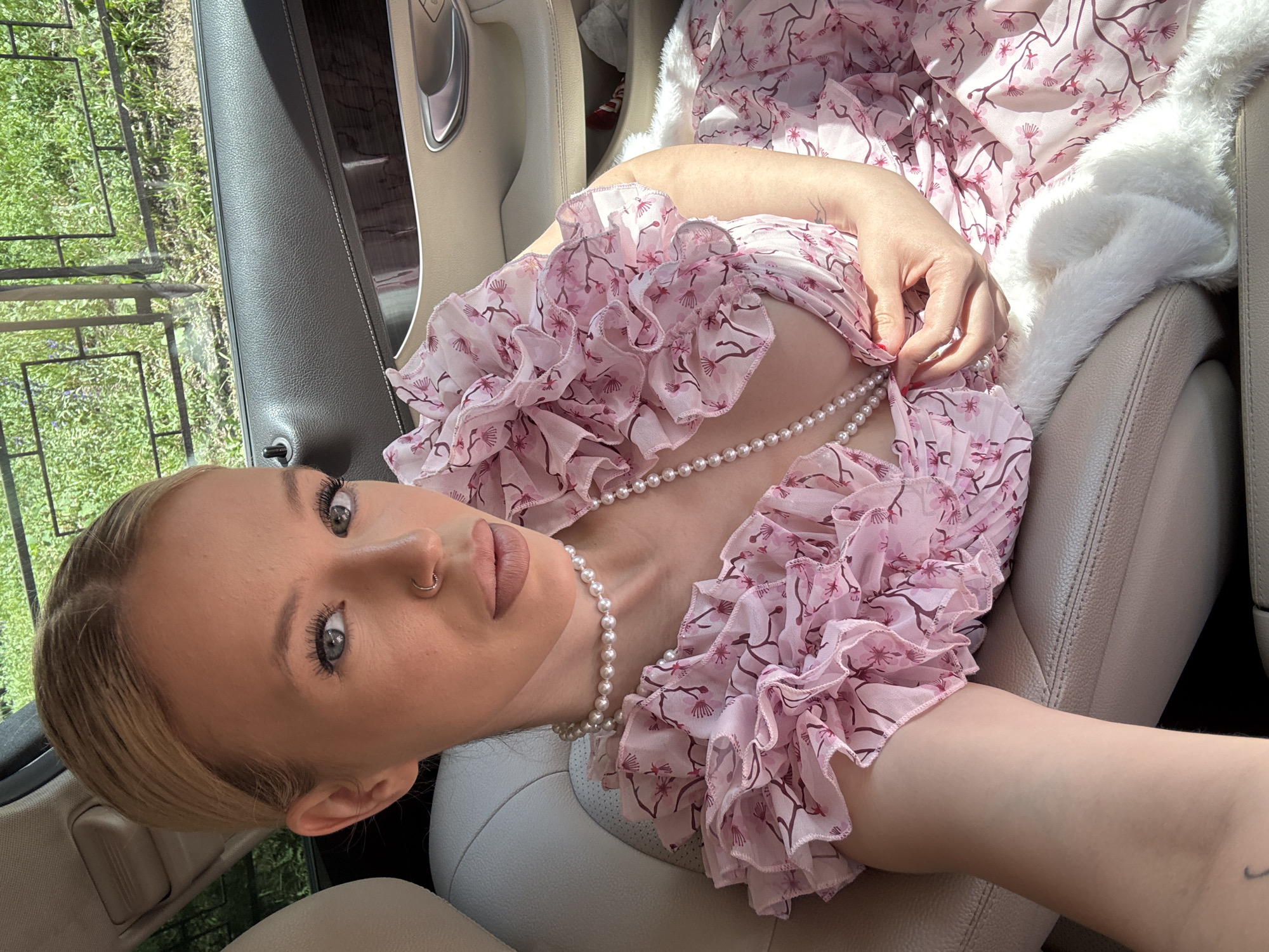 Dressed-up passenger selfie in a Saint Petersburg car