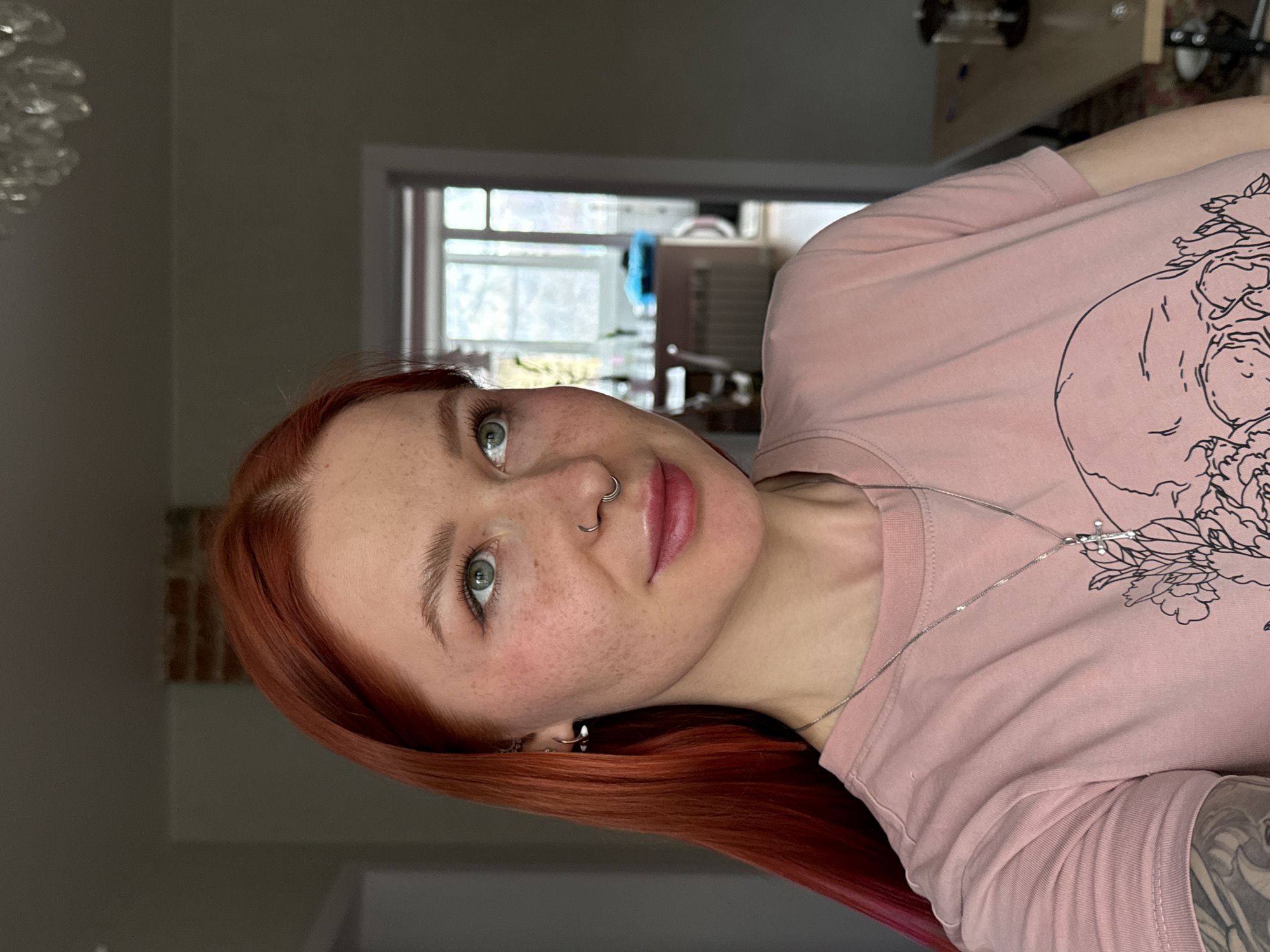 Red-haired woman takes selfie in Rostov-on-Don apartment