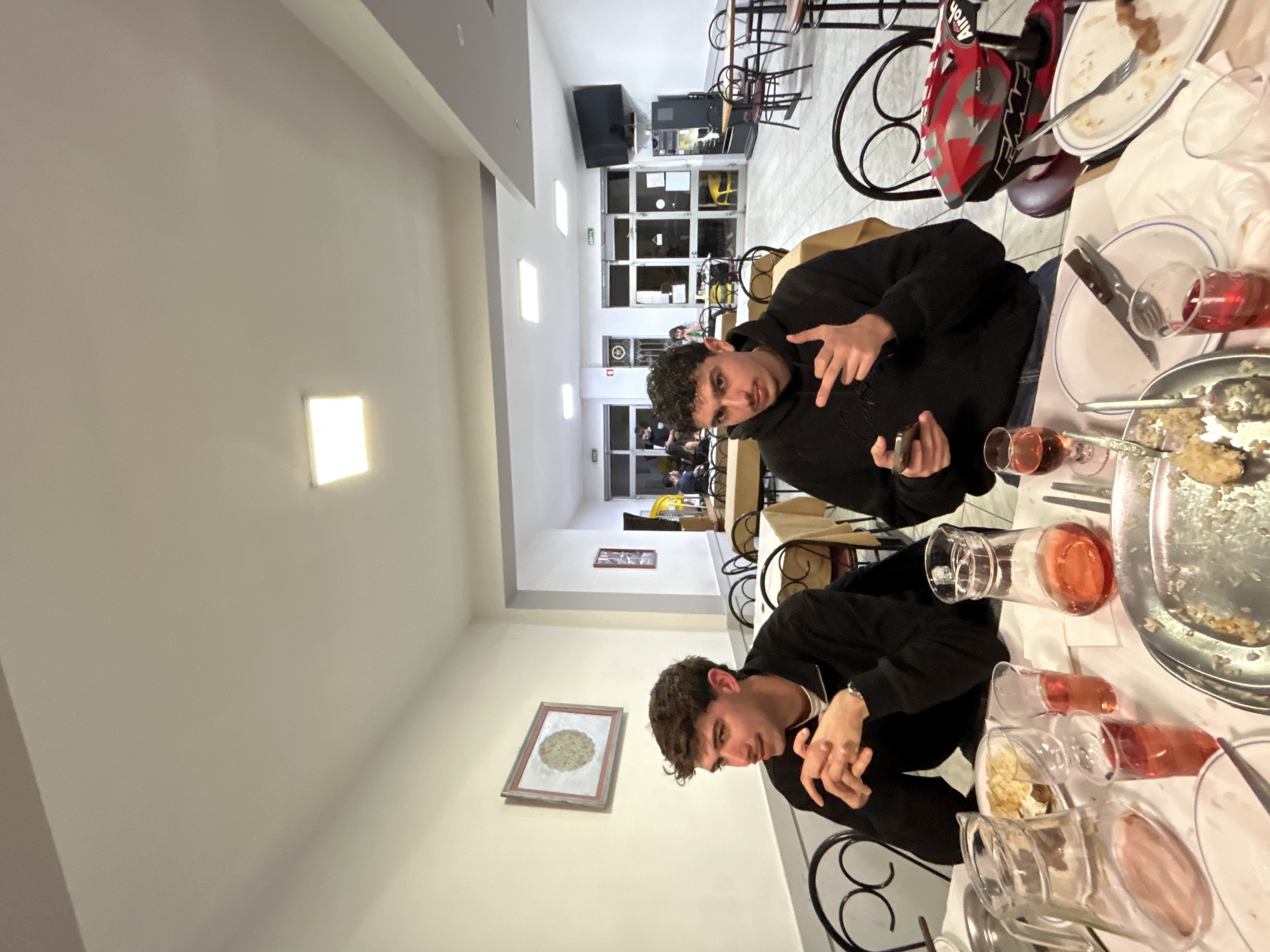 Young men dine together at Vila Real restaurant