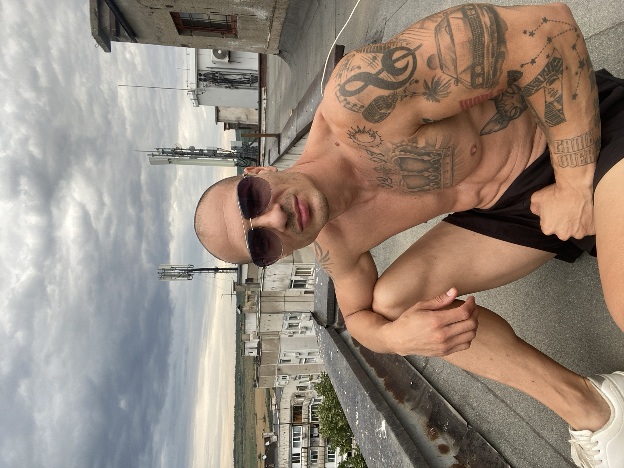 Tattooed rooftop session above Pleven's Soviet-era skyline