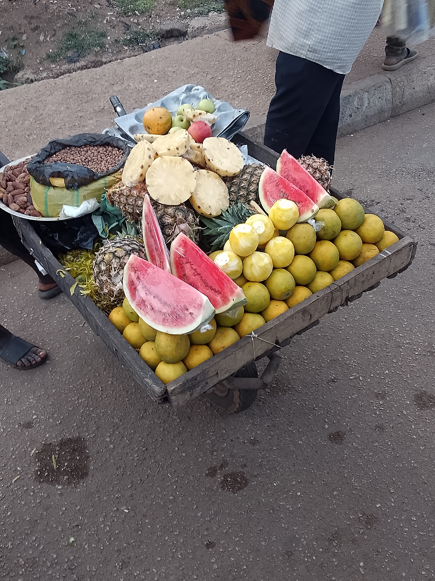 Street vendors sell fruits and nuts in Bukuru, Nigeria