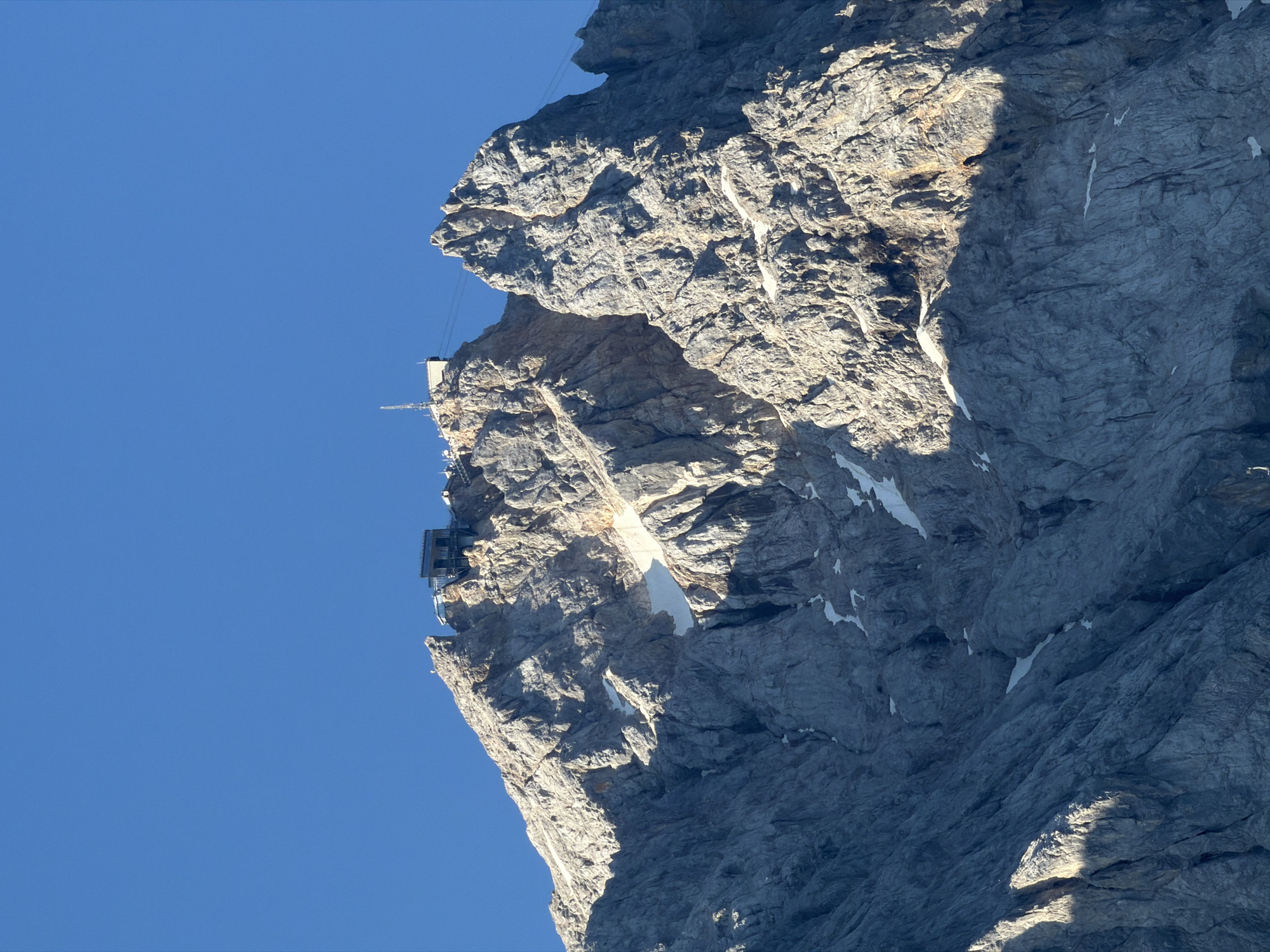 Zugspitze and its cable car infrastructure on a clear morning