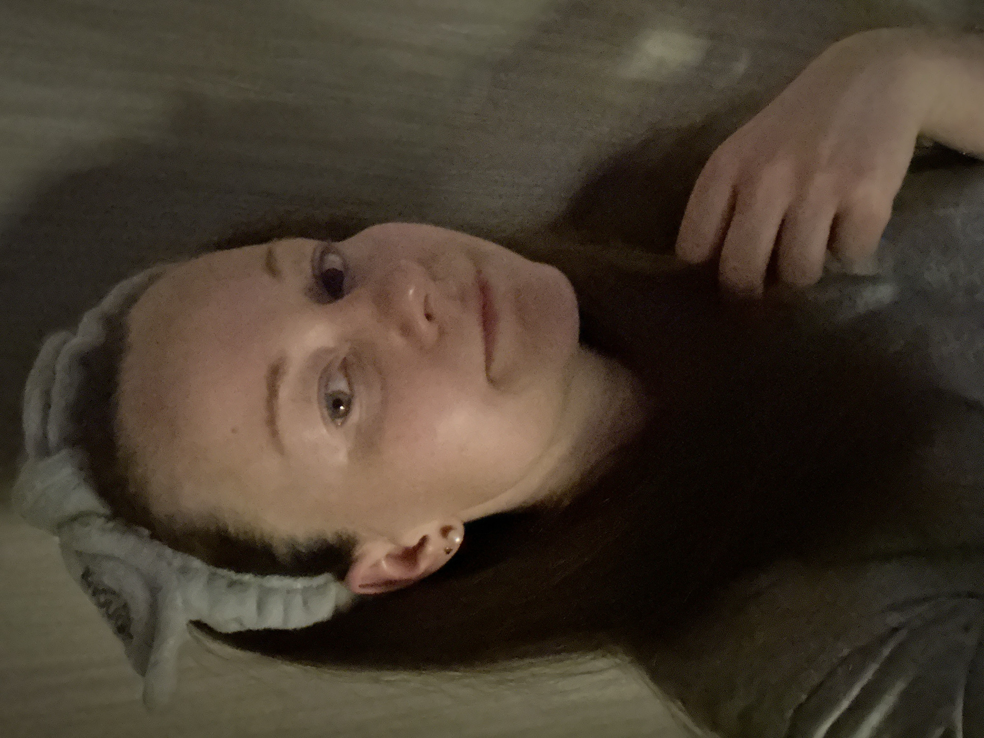 Woman photographed in Moscow wearing "ENOUGH" headband during afternoon