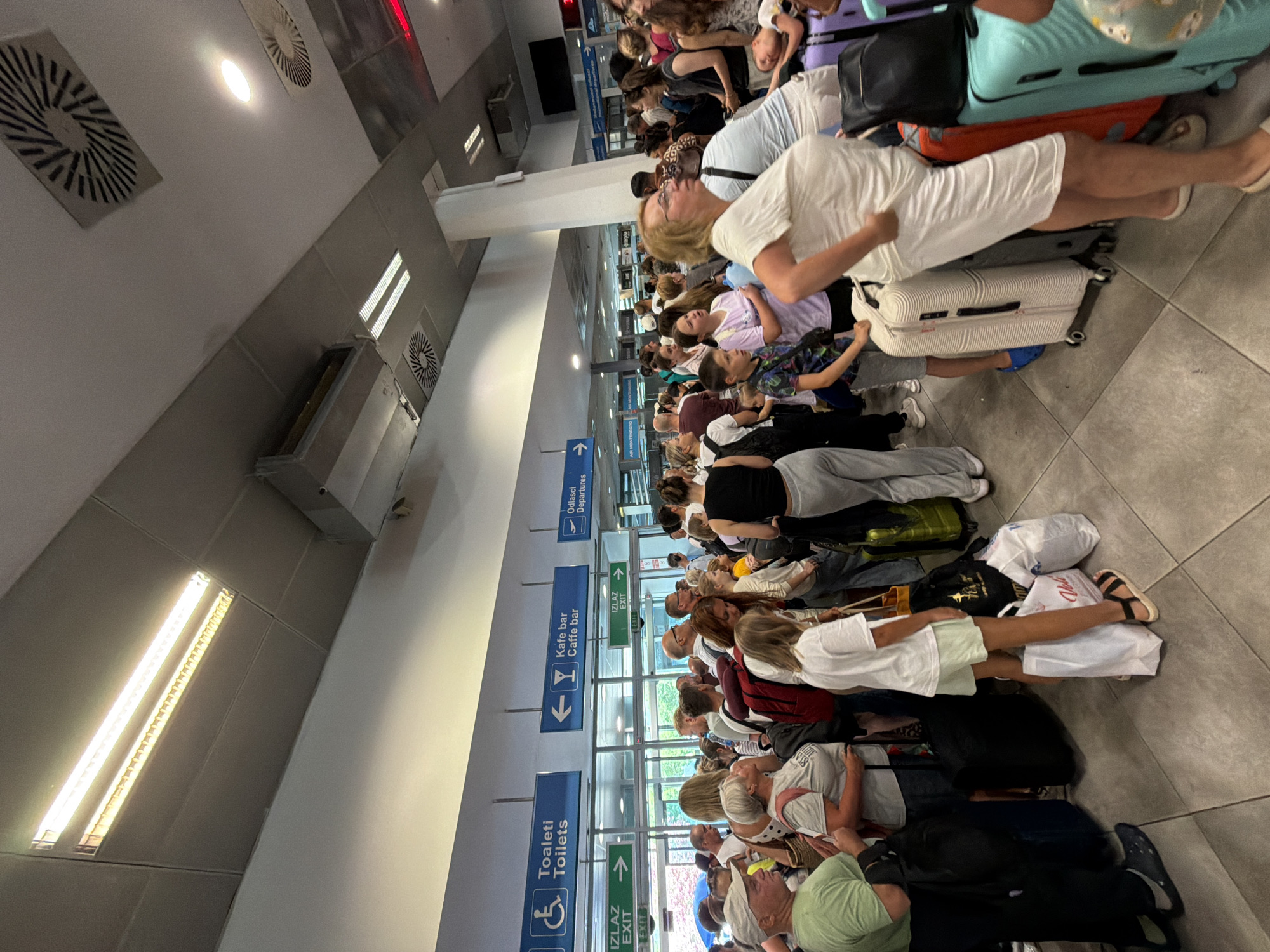 Tivat Airport packed with travelers on a busy summer morning