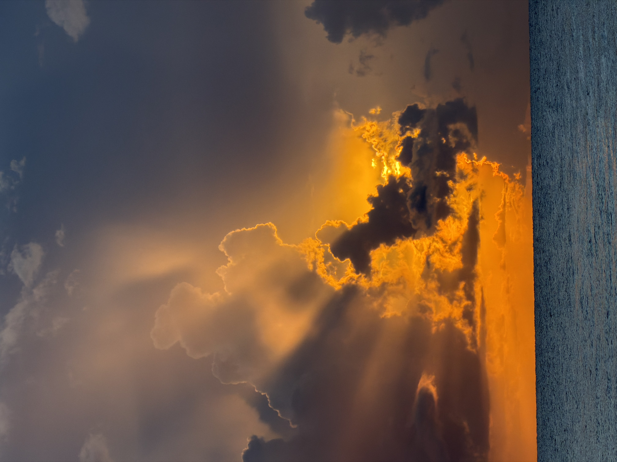 Storm clouds and golden light over Miami Beach at sunset