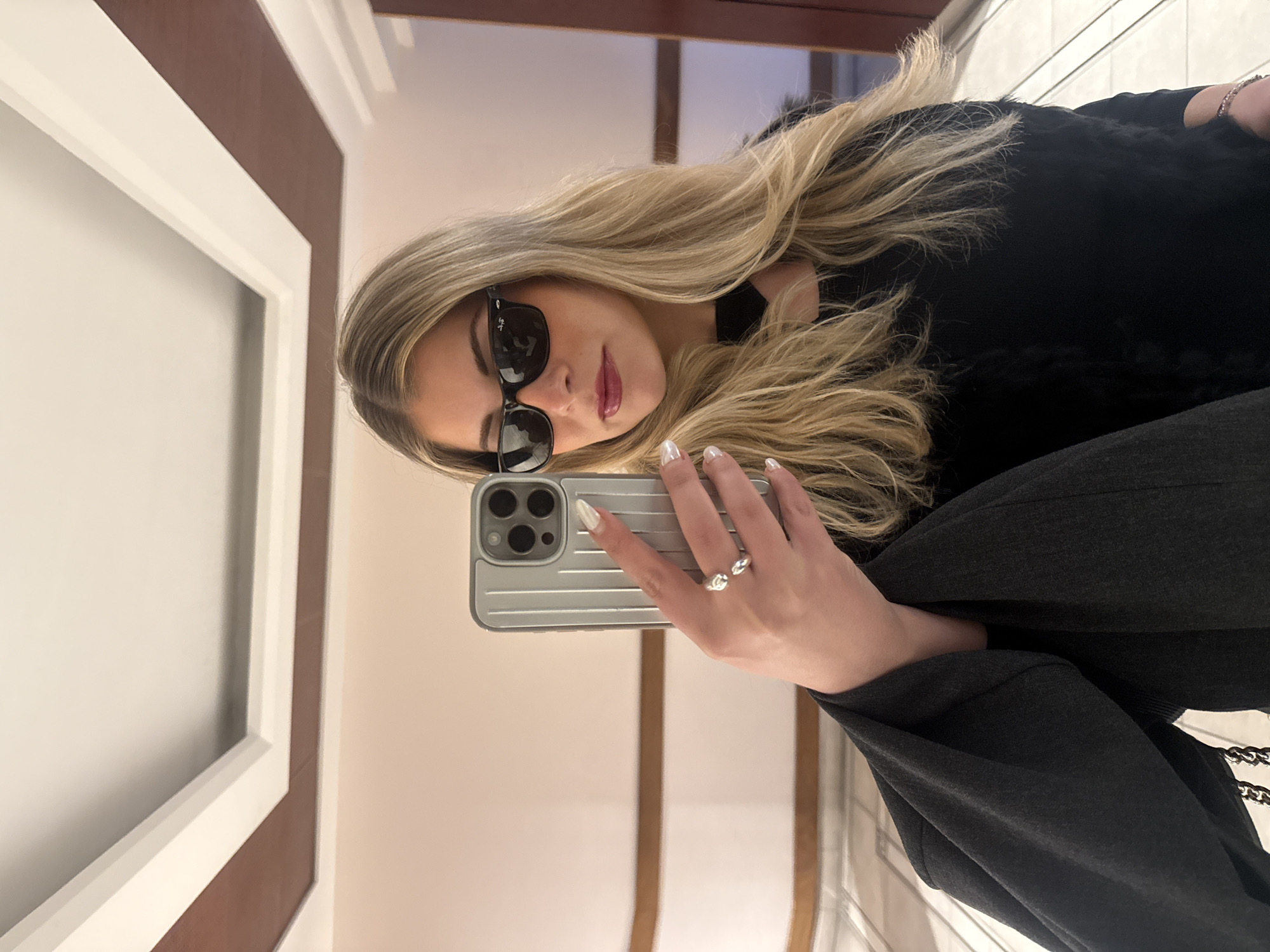Woman takes mirror selfies in Paris bathroom
