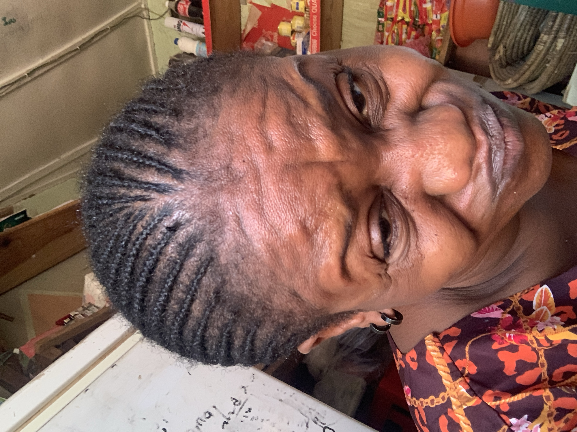 Woman in traditional garment photographed indoors in Nigeria