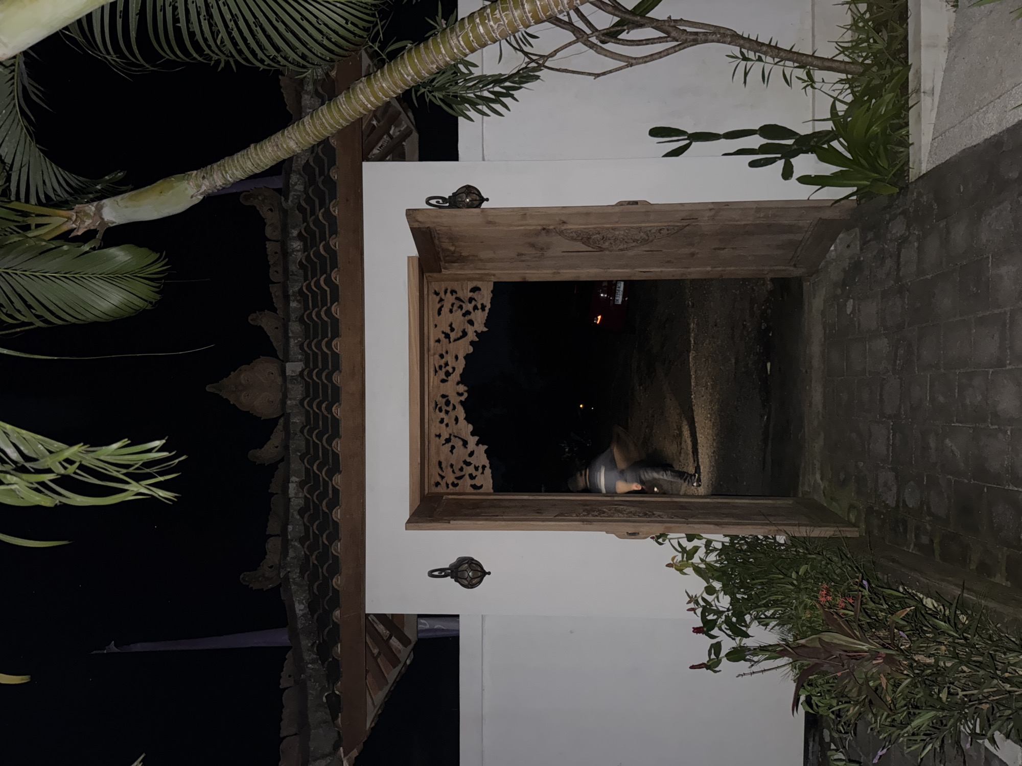Nighttime scene documented at building entrance in Ungasan, Indonesia