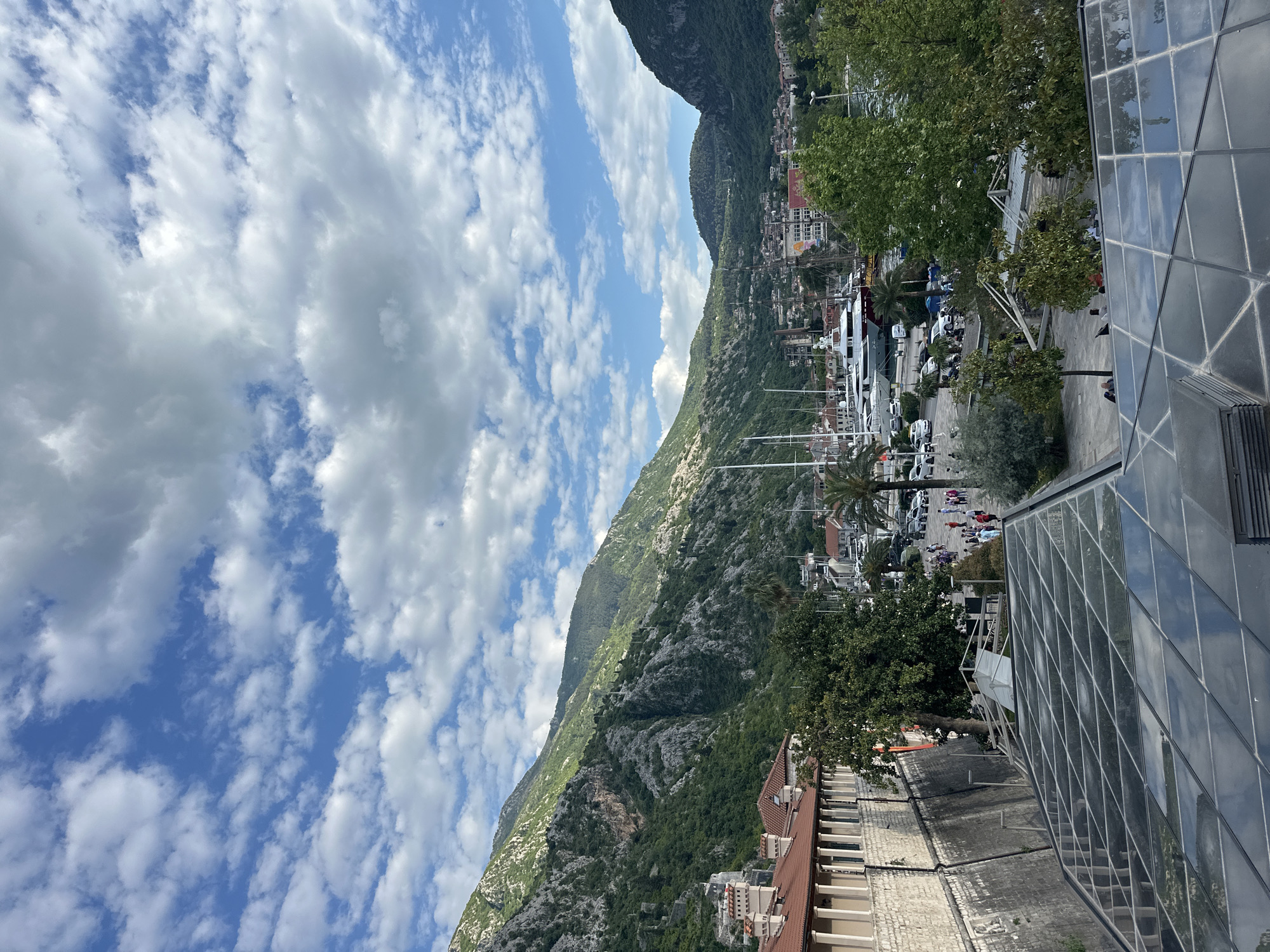 Tourist documents scenic views of historic Kotor, Montenegro