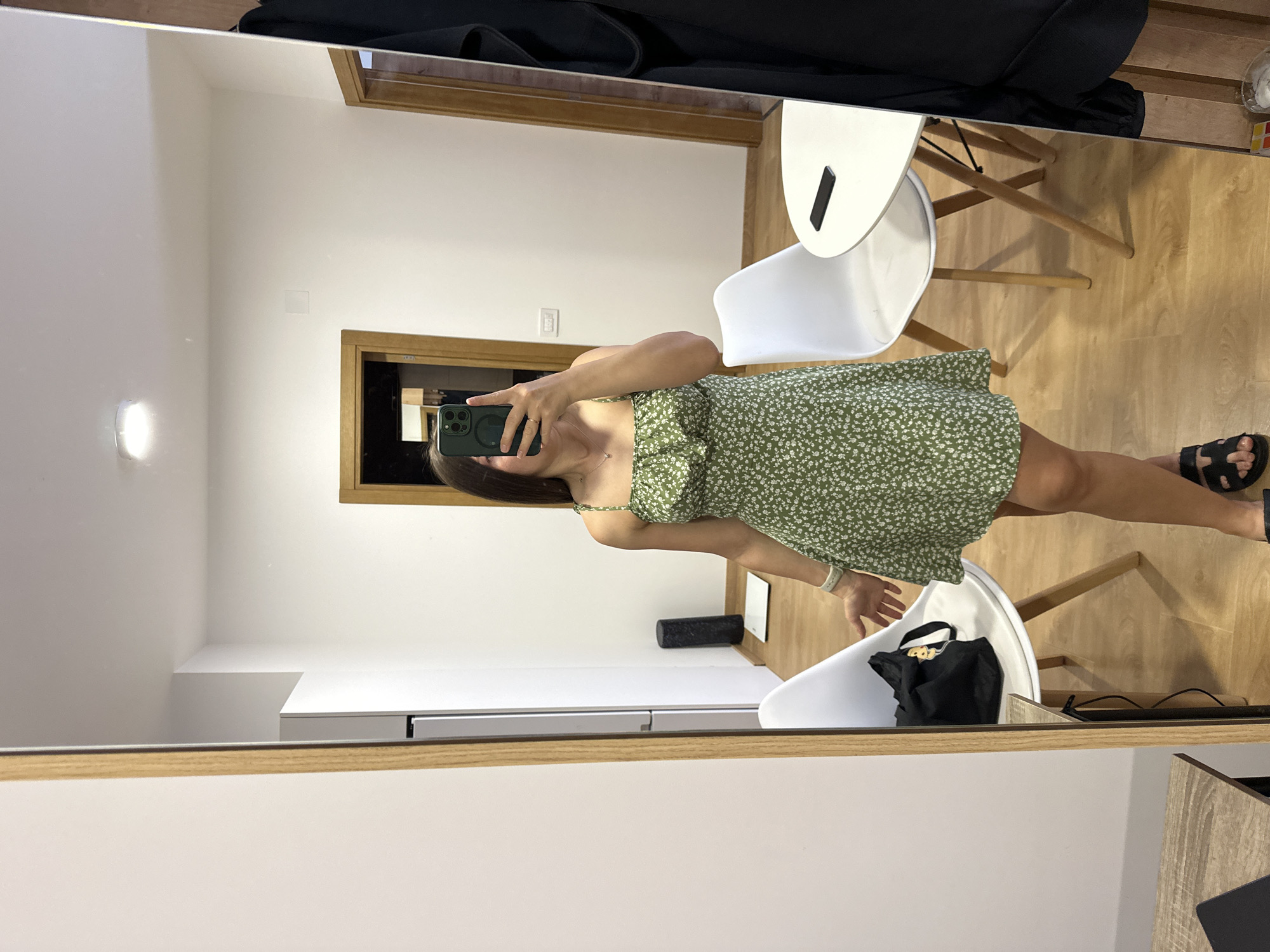 Woman takes mirror selfie in green dress, Montenegro