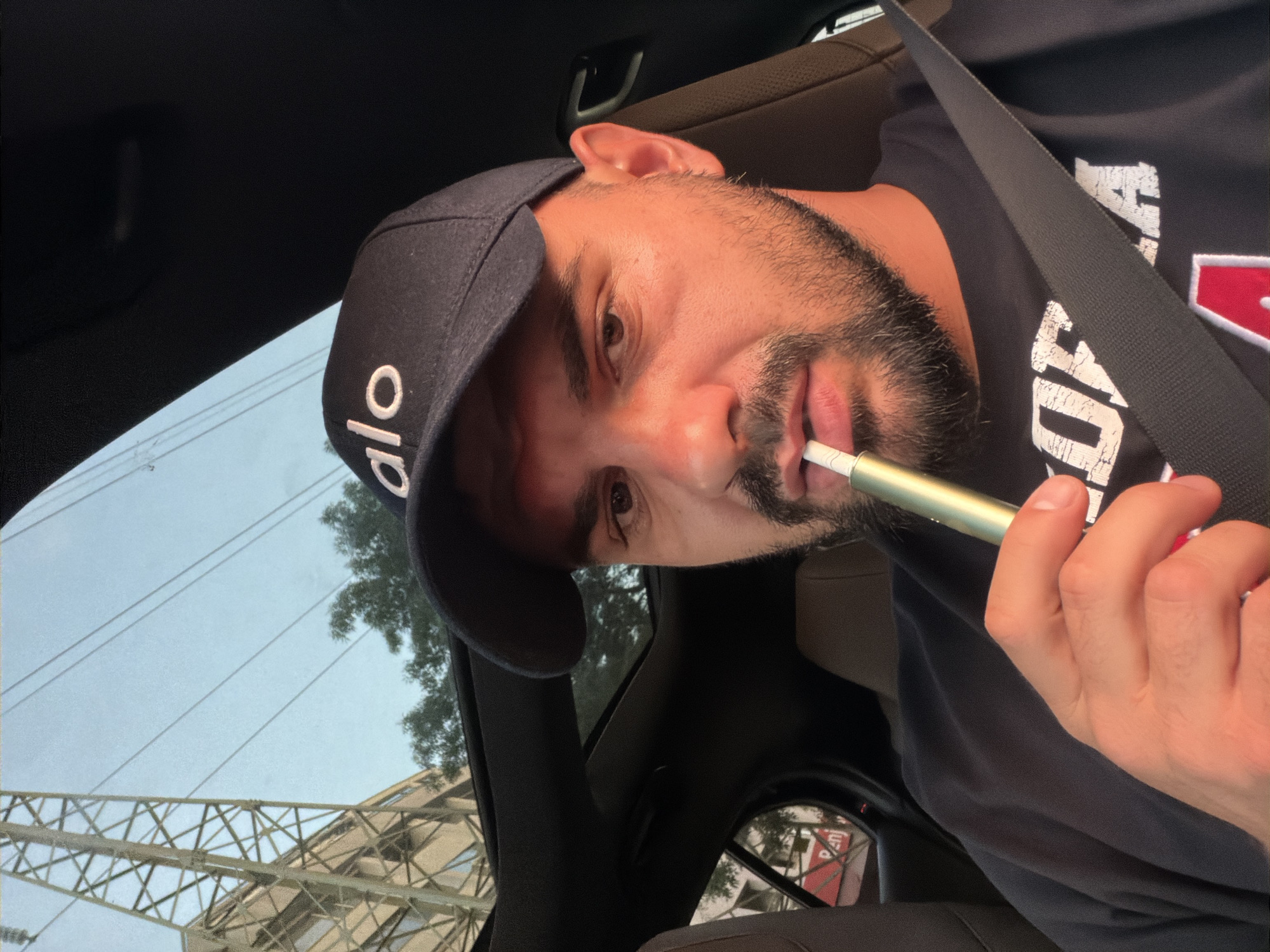 Car selfie in Sofia, dark cap with 'alo' branding