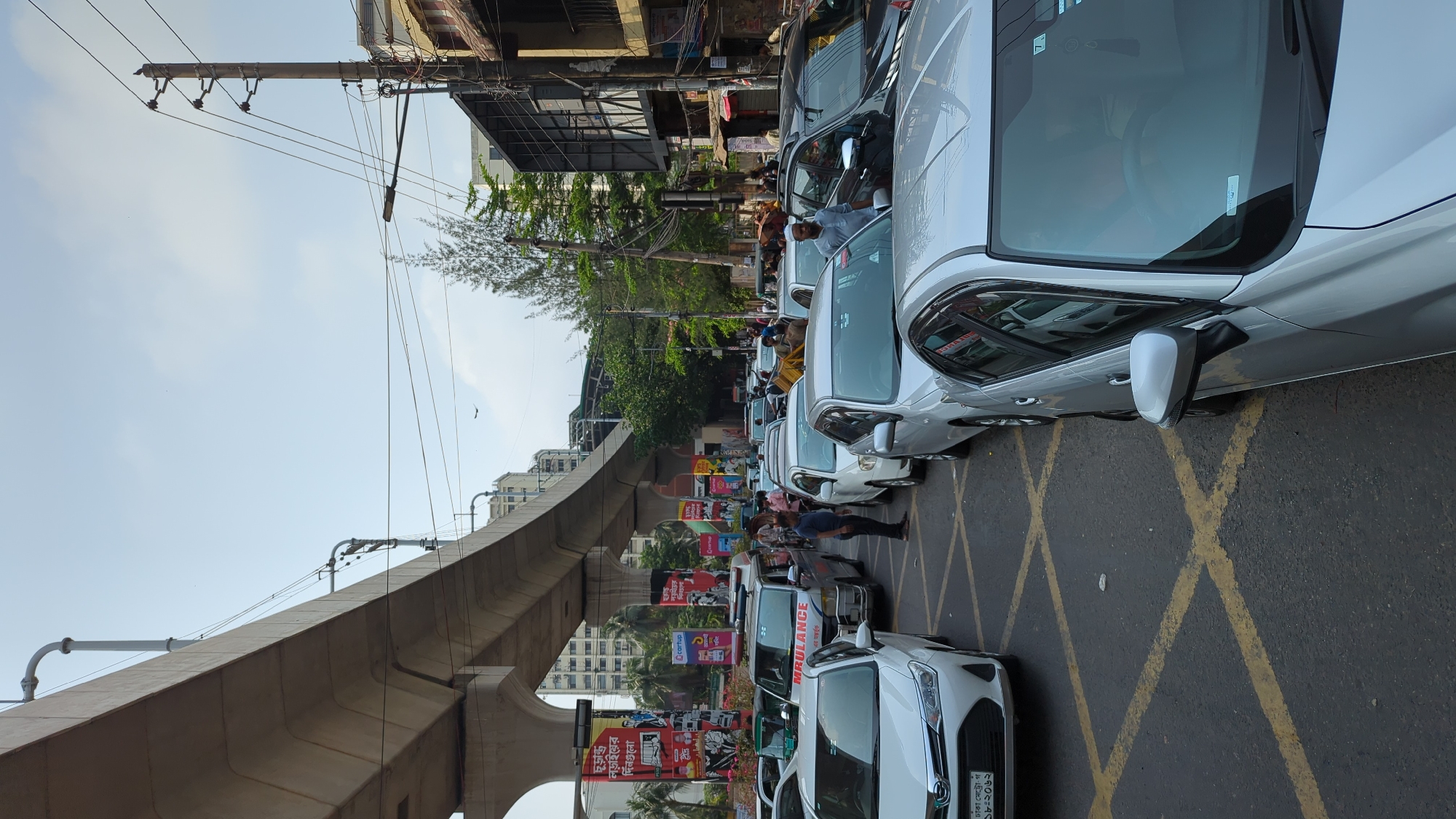 Motorcyclists queue for fuel at Dhaka gas station