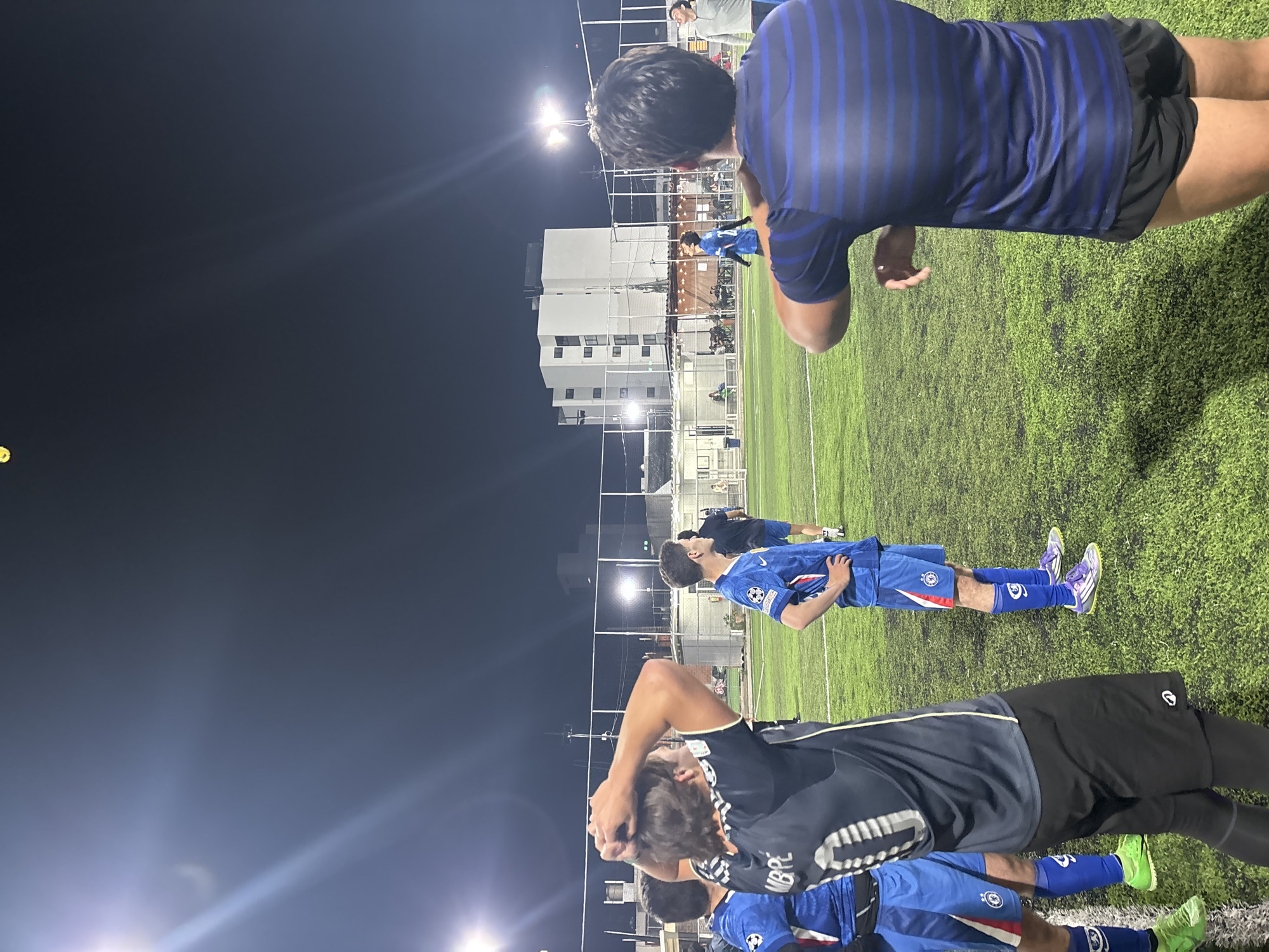 Illuminated soccer field captured at night in Tlaxcalancingo