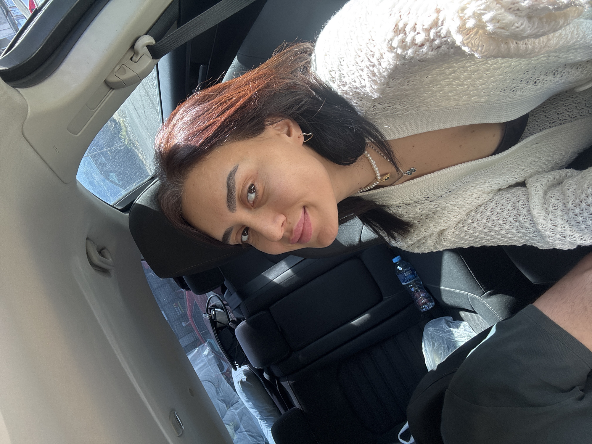 Car selfie session in Tbilisi, white cardigan and pearls