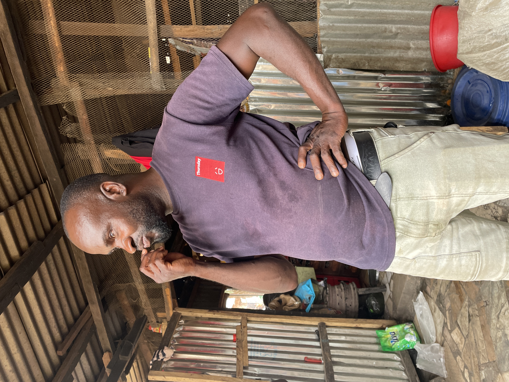 Street vendors and artisans work in Jos commercial districts