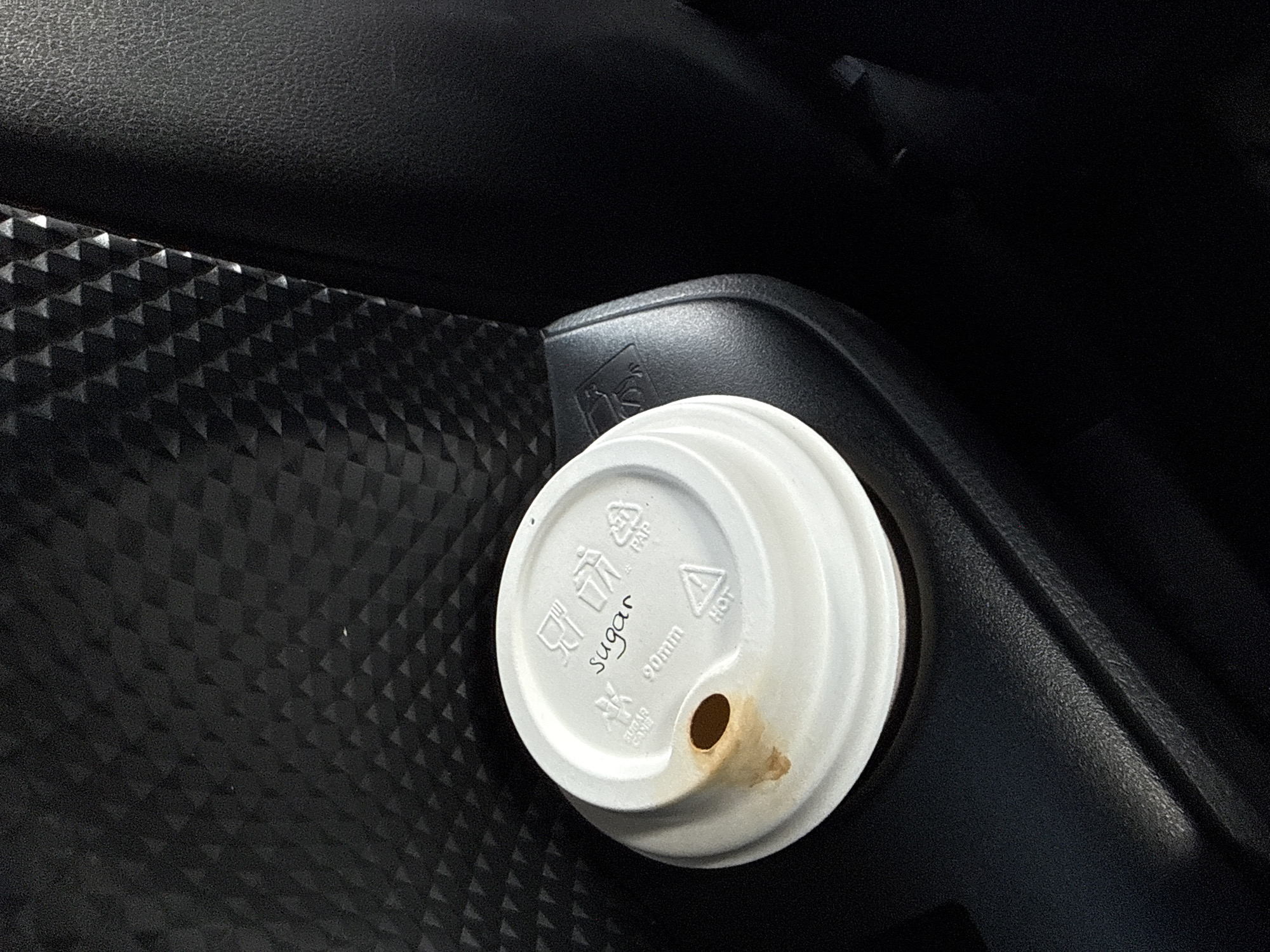 Used coffee cup lid spotted in vehicle, Serbia
