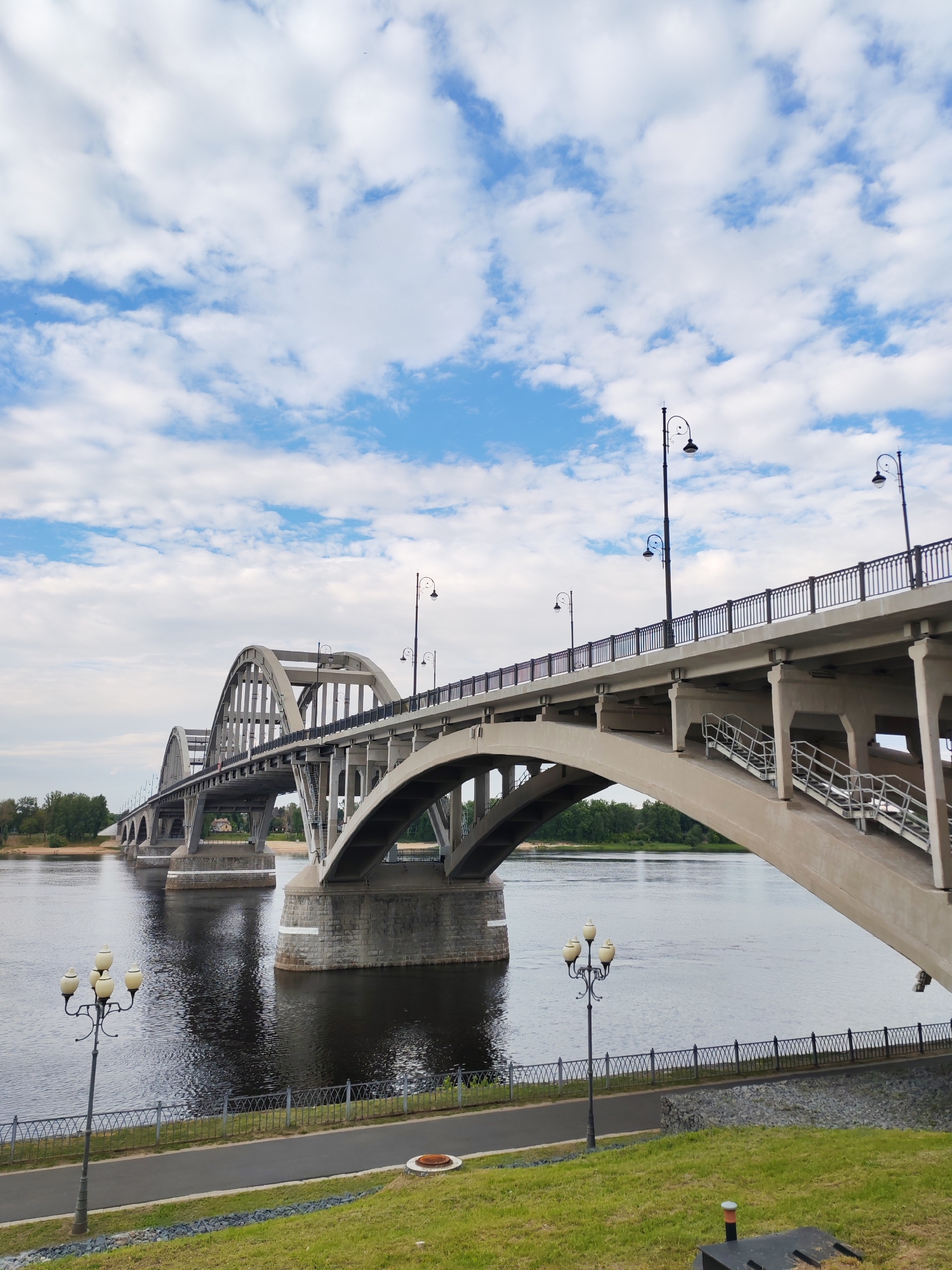 Riverside town landmarks: bridge, Orthodox church, anchor monument