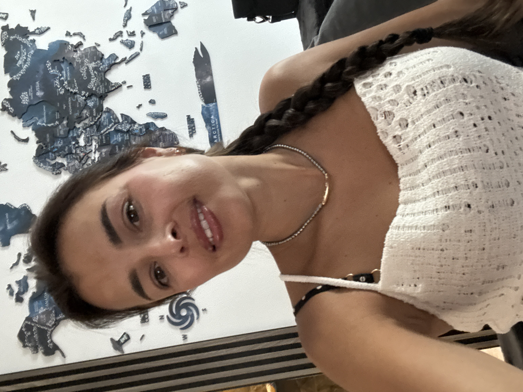 Selfie session in front of a world map wall