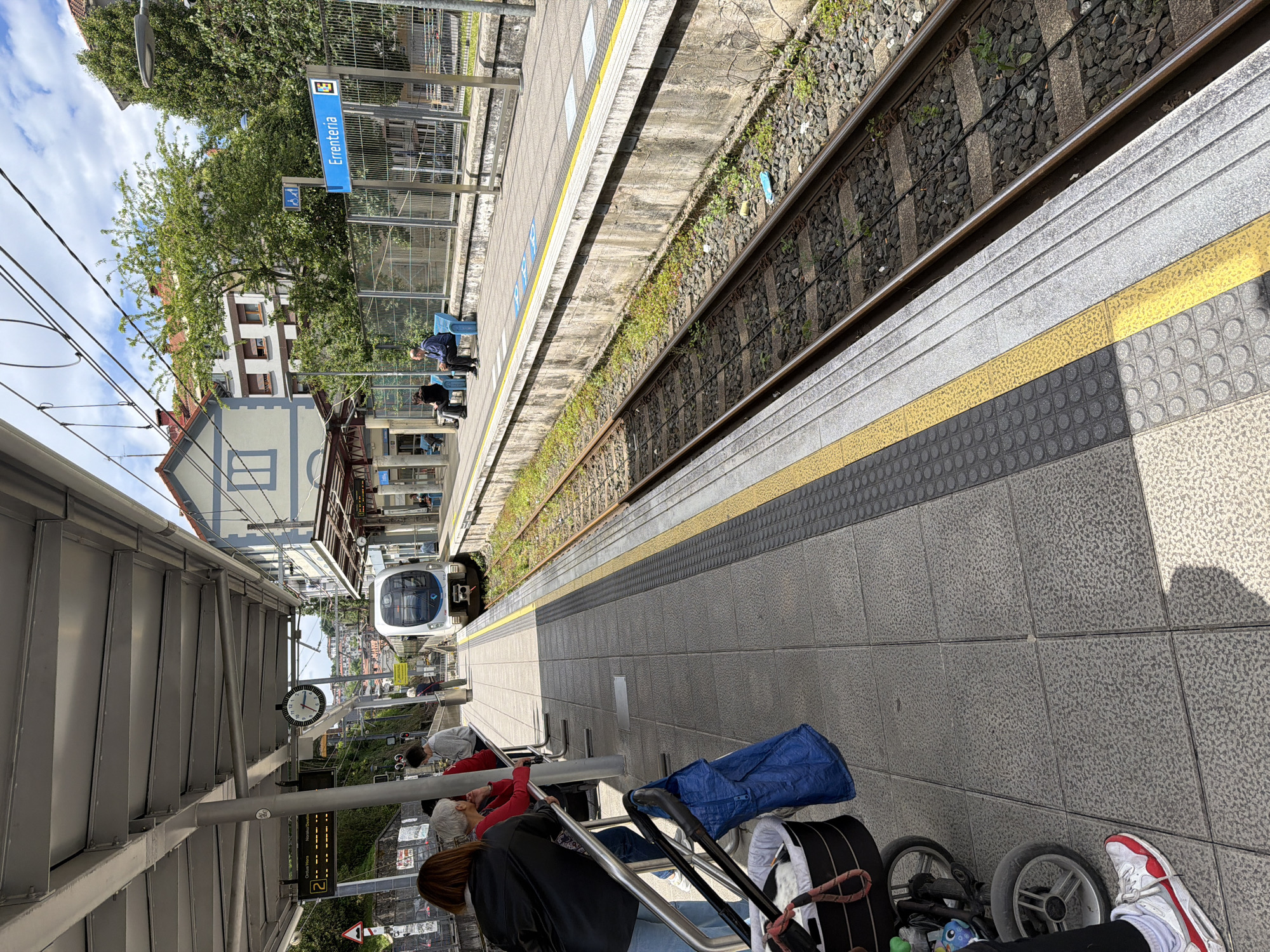 Train arrives at Errenteria station with dog on platform
