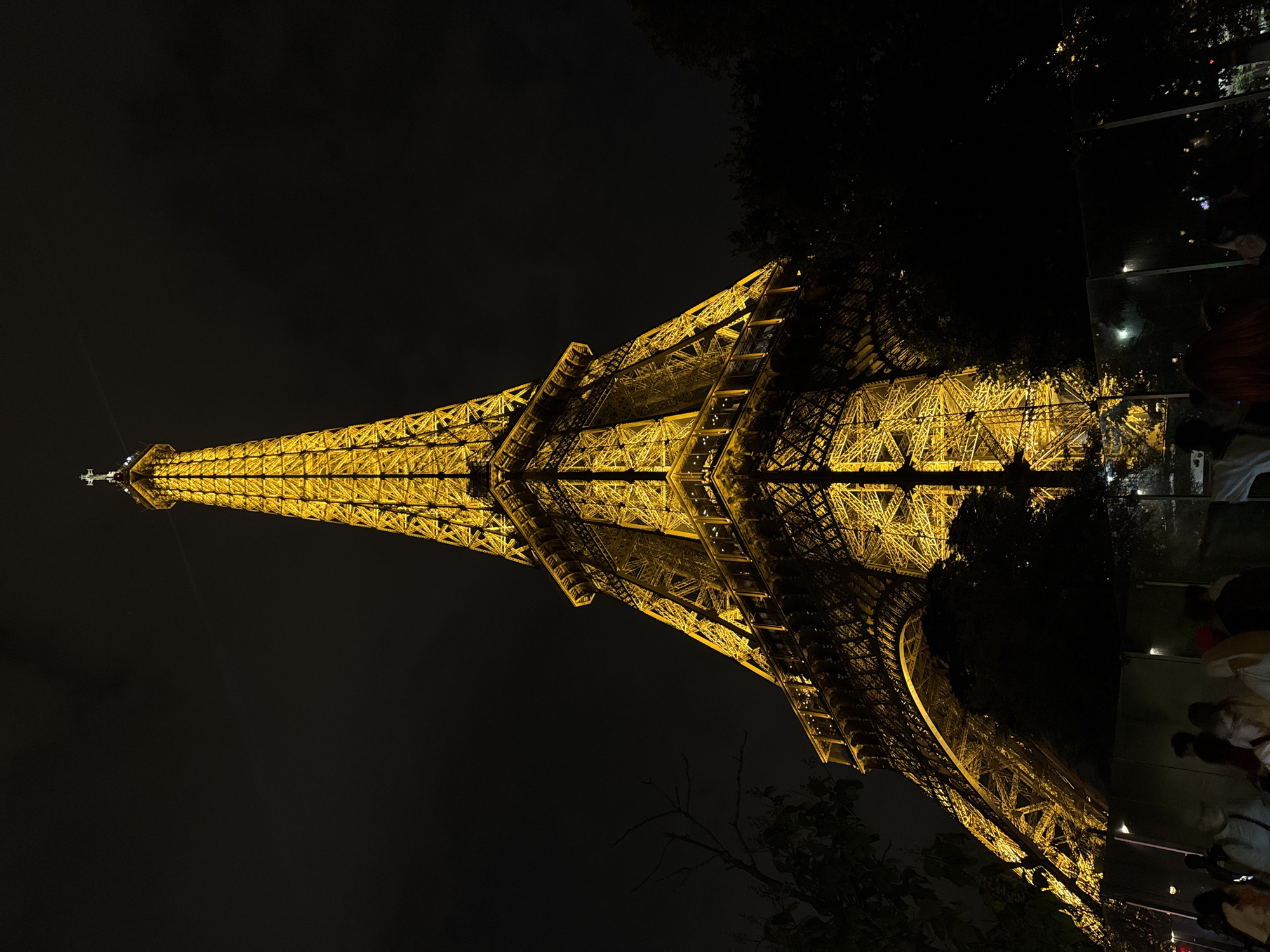 Eiffel Tower glows in evening illumination, Paris