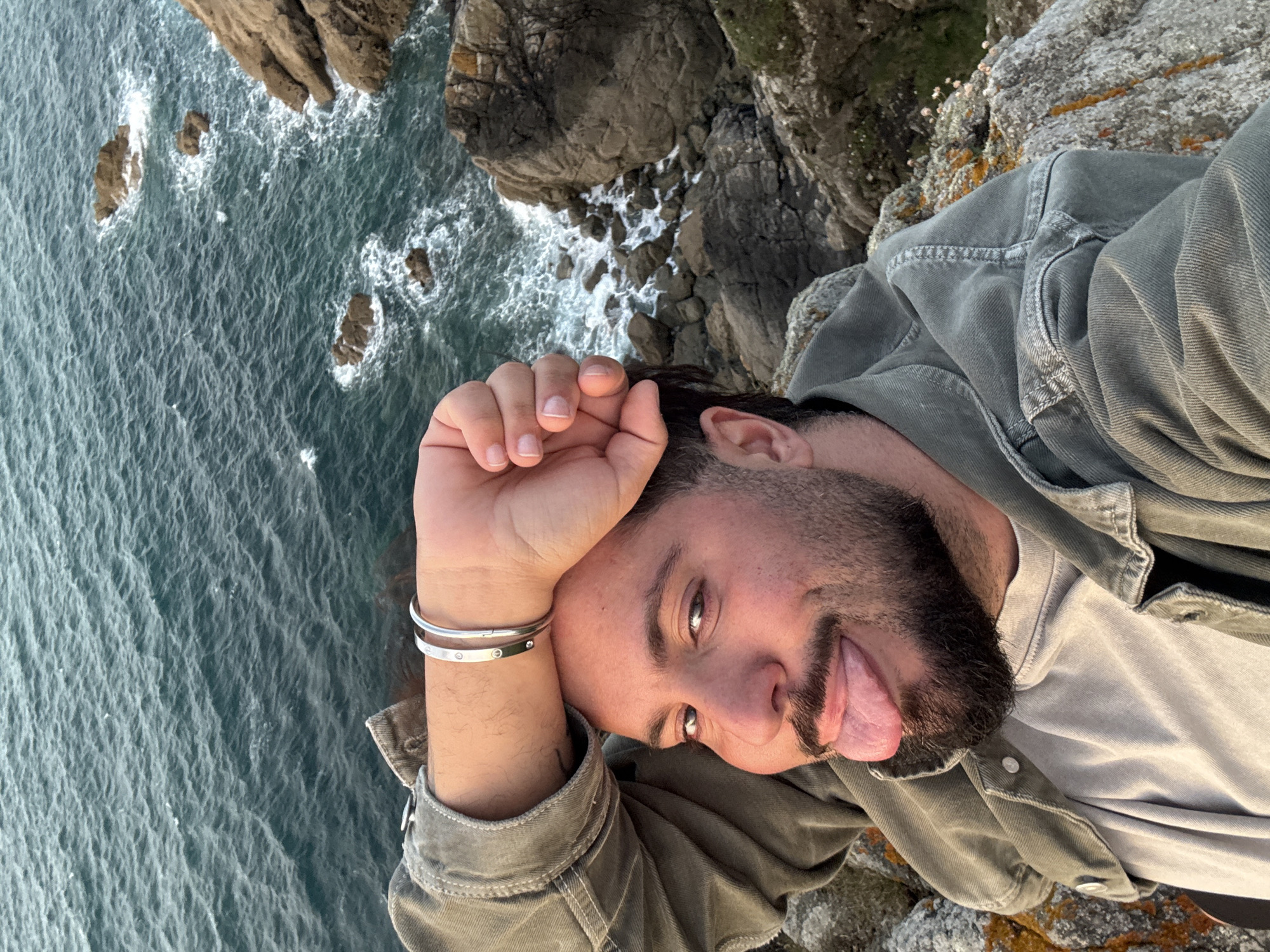 Tourist captures sunset, coastal views in Saint-Malo during evening visit