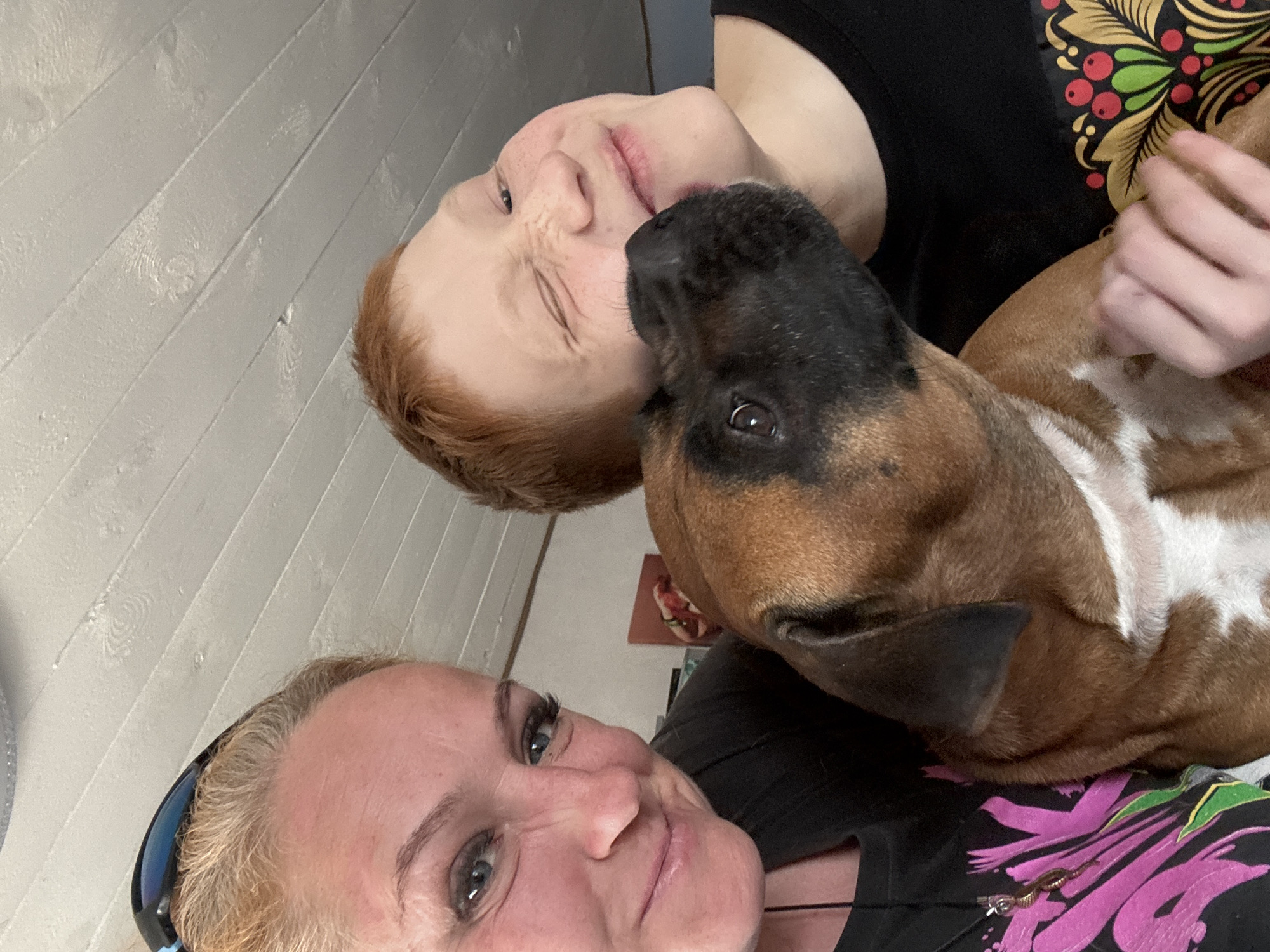Family shares quiet moment with pet dog in Chaikovsky