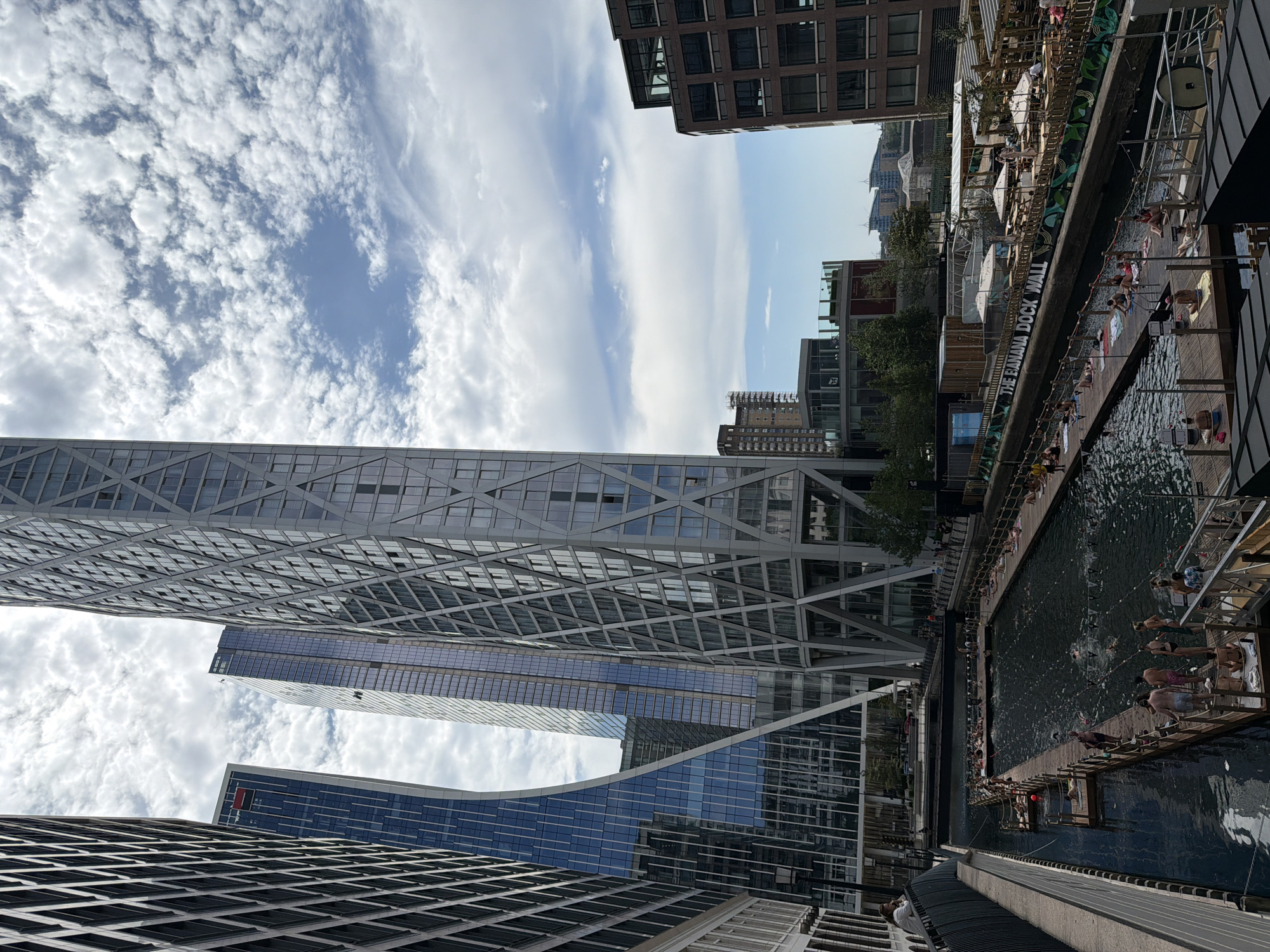 Open-water swimming in Canary Wharf's dock on a summer afternoon