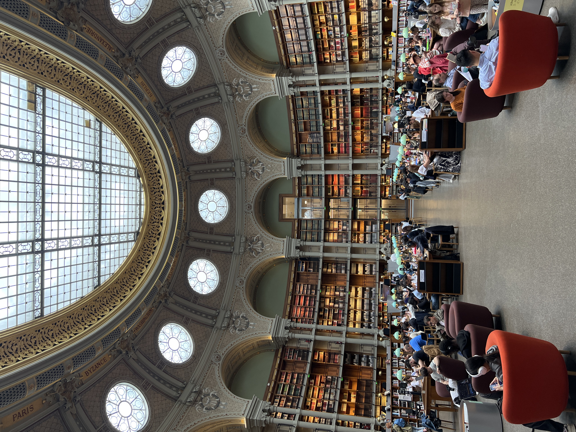 Parisians study in historic library reading rooms beneath glass domes