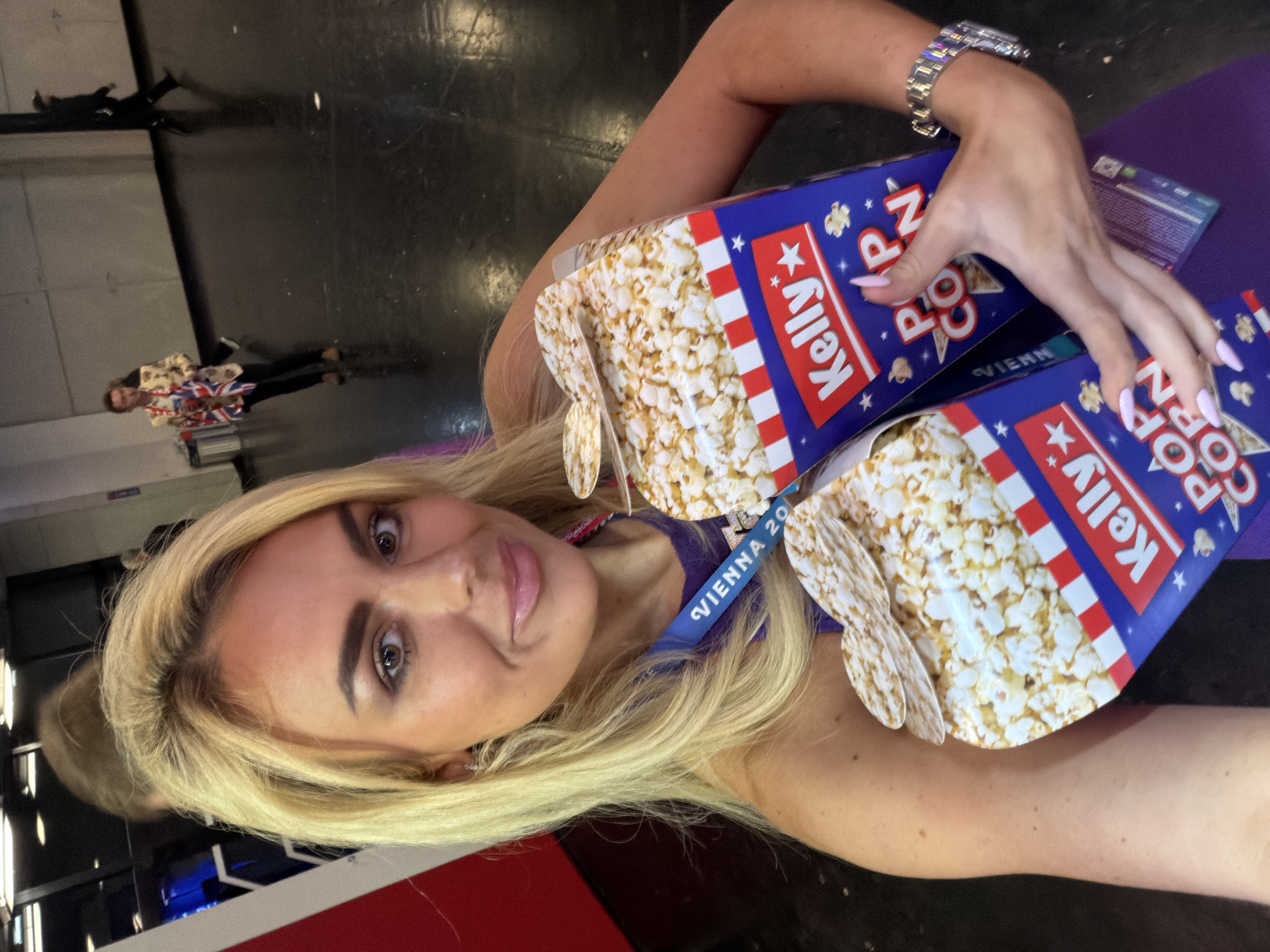 Woman takes selfies with popcorn boxes in Vienna