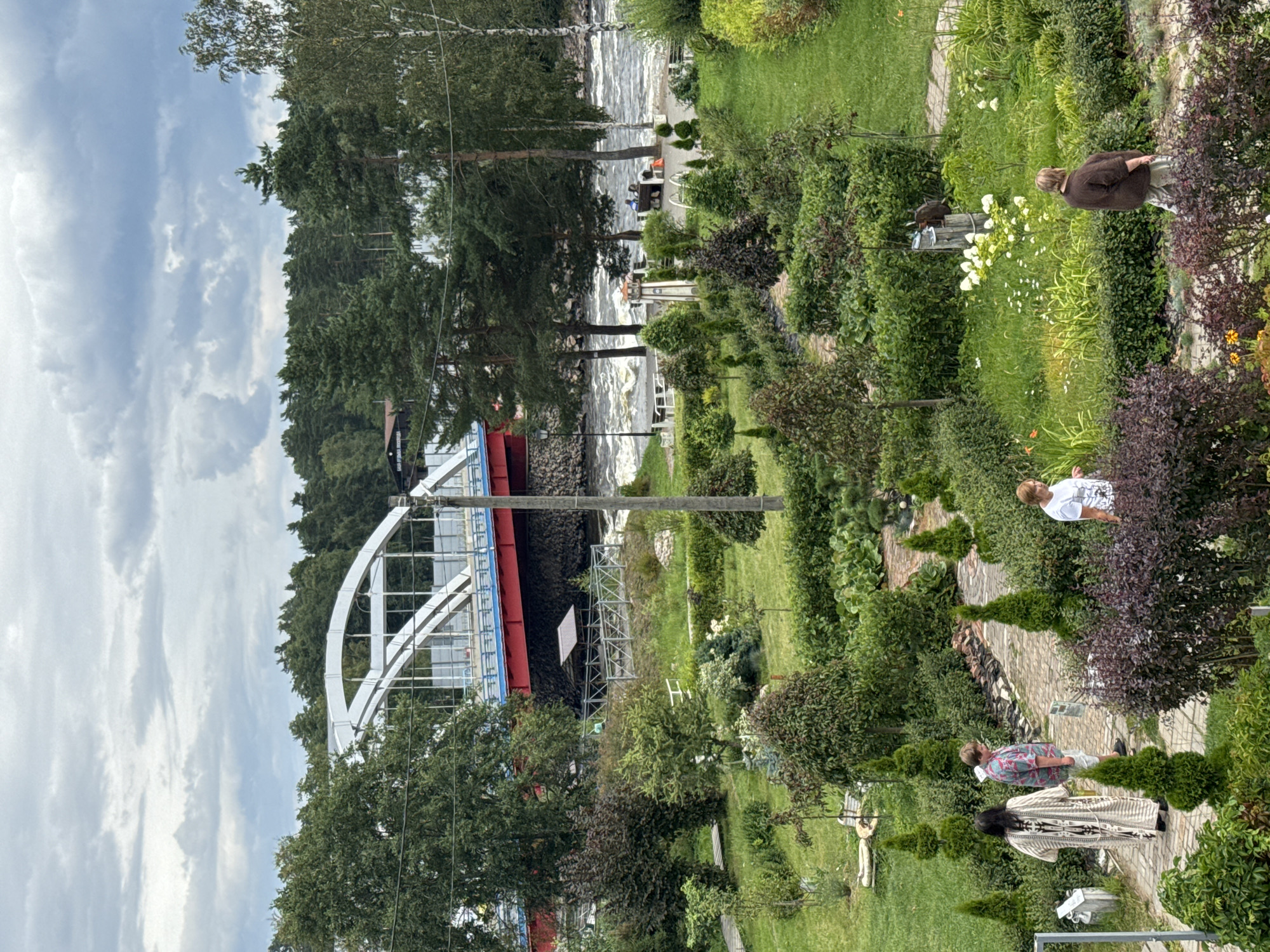 Summer day at Losevo's riverside park, rapids, and cafe