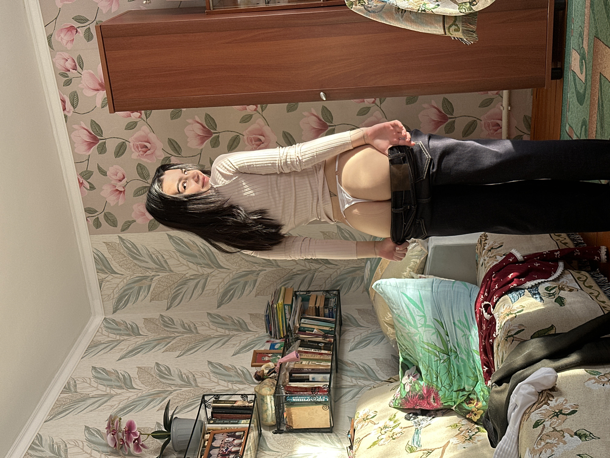 Young woman photographed in residential setting in Aktanysh