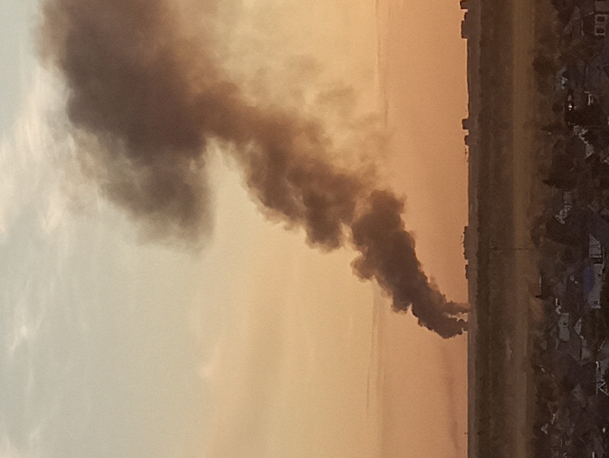Dark smoke plume rises over Kondratovo village, Russia