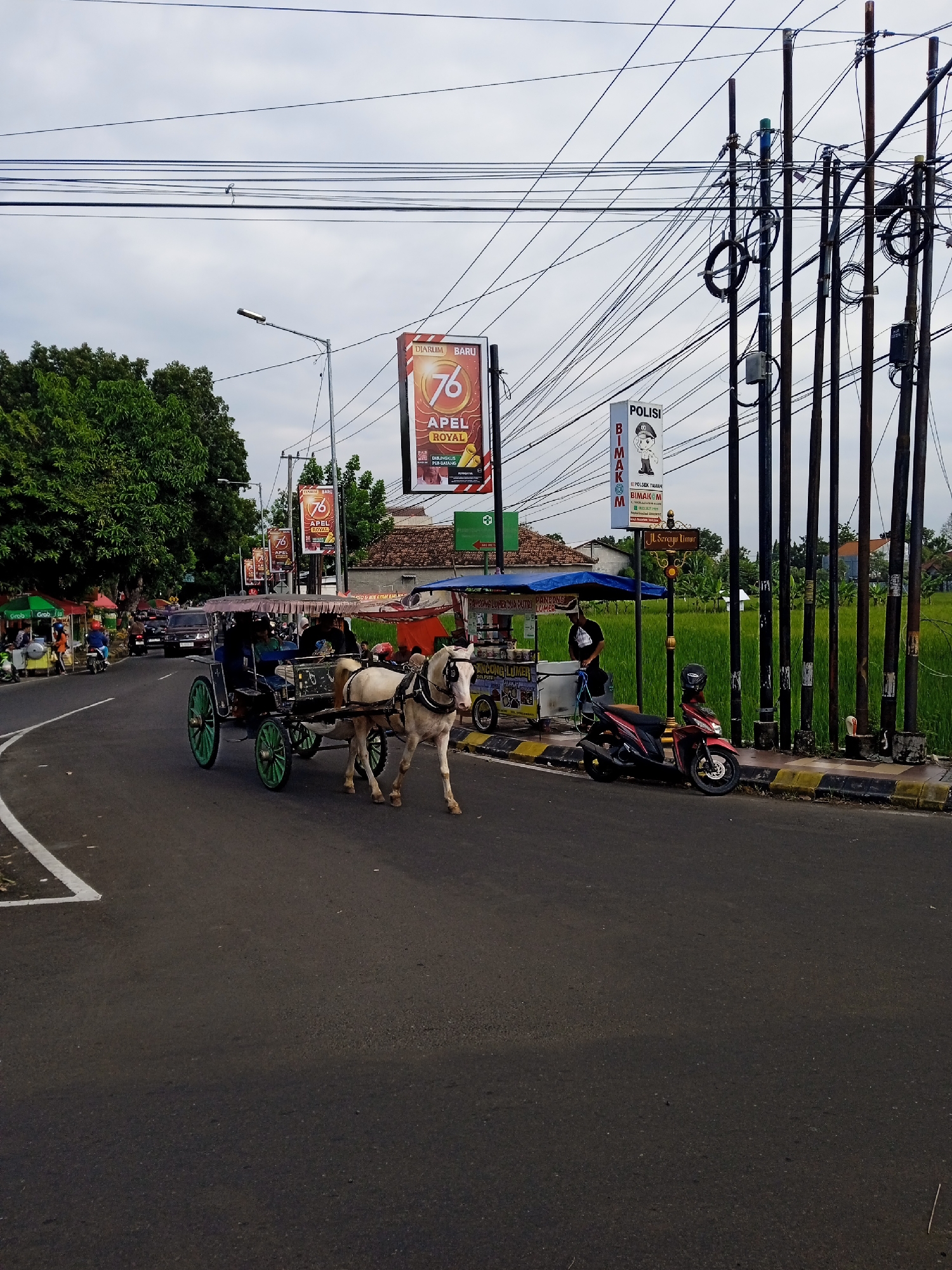 Late-night street life documented across Madiun, Indonesia commercial districts