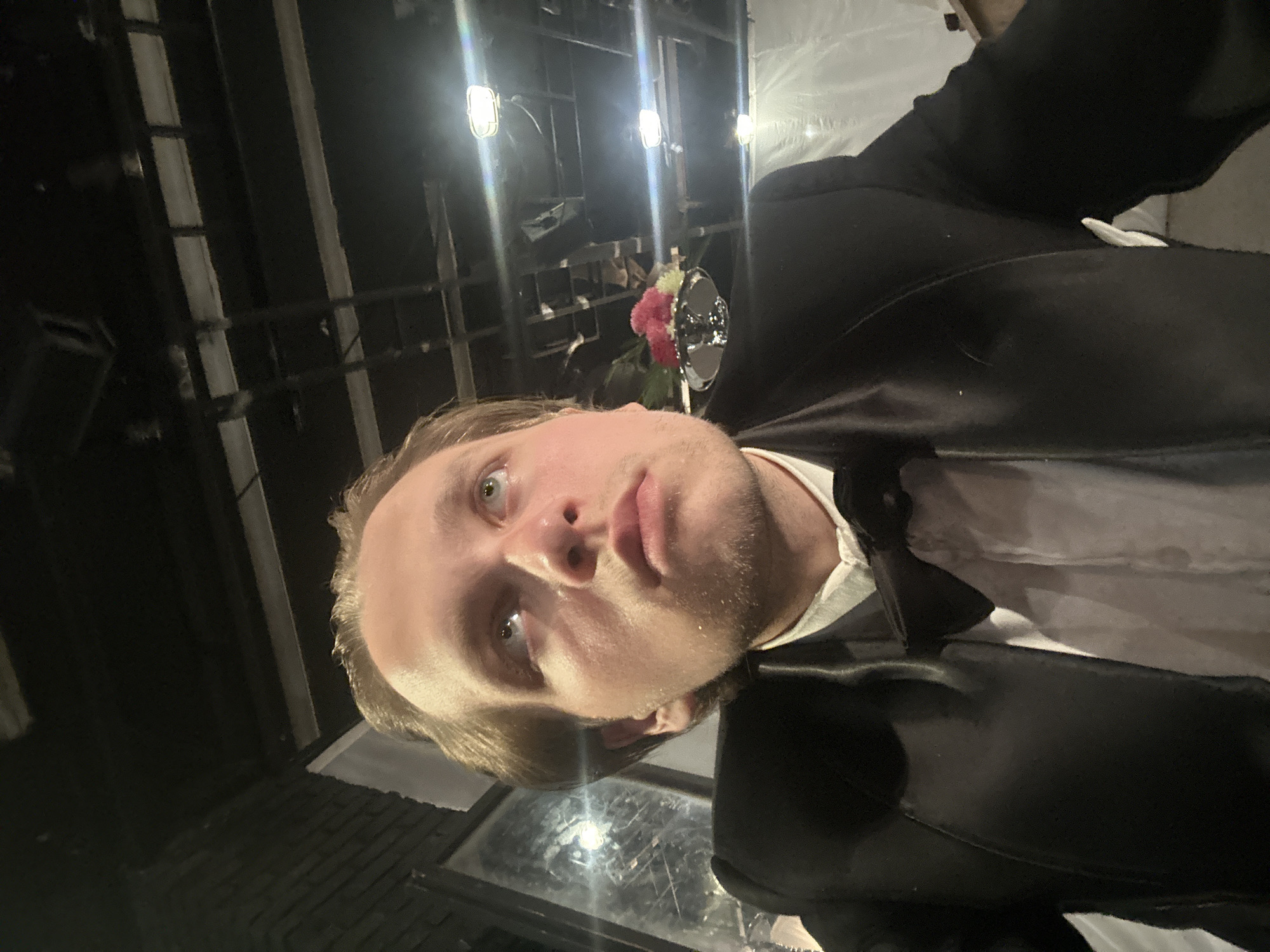 Backstage downtime in formal wear before a show