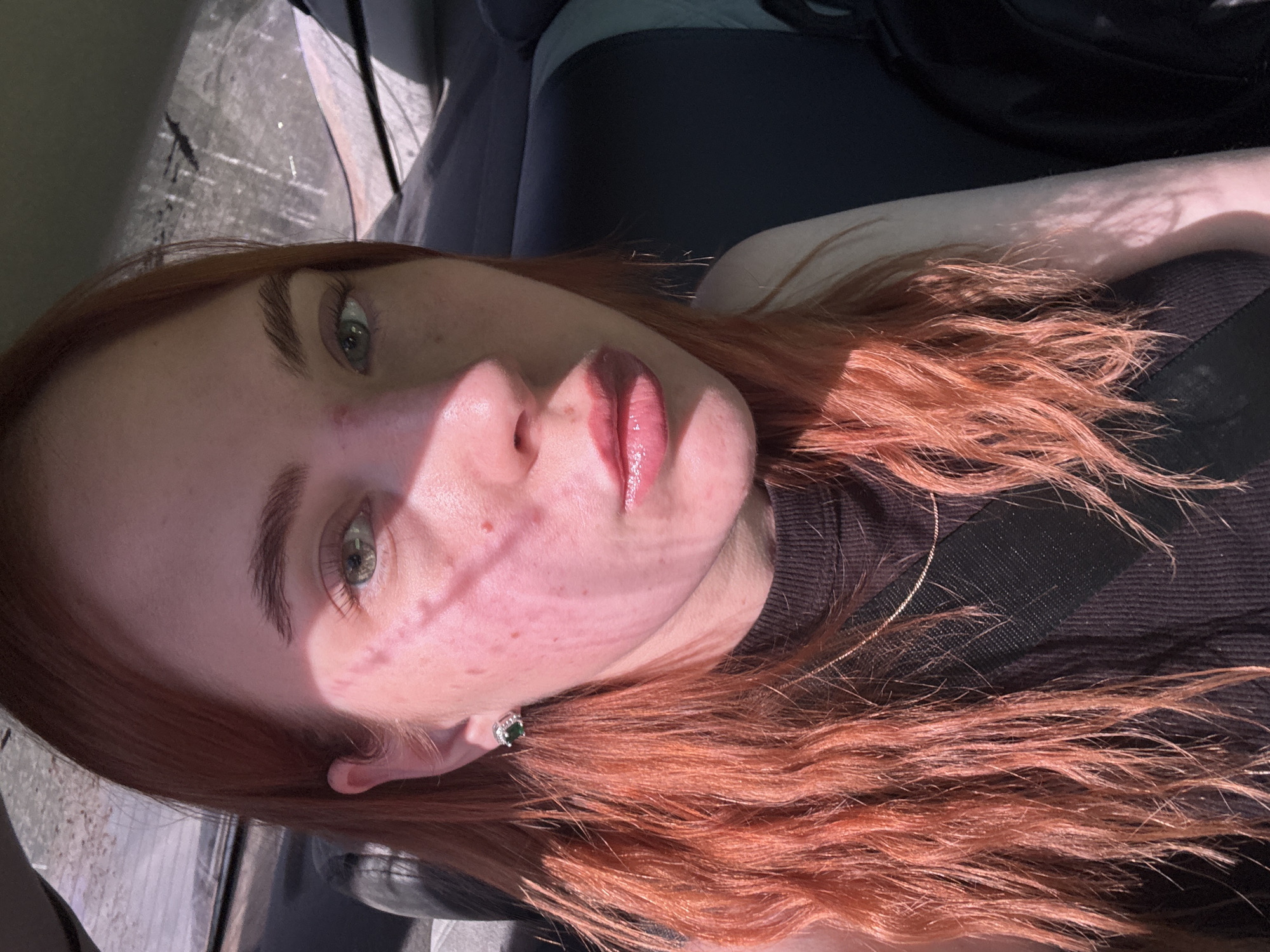 Woman with red hair photographed in car in Starobaltachevo