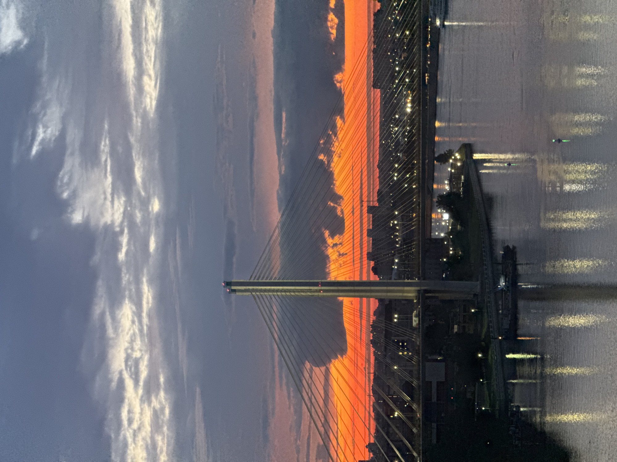 Cable-stayed bridge over a Russian river at golden hour