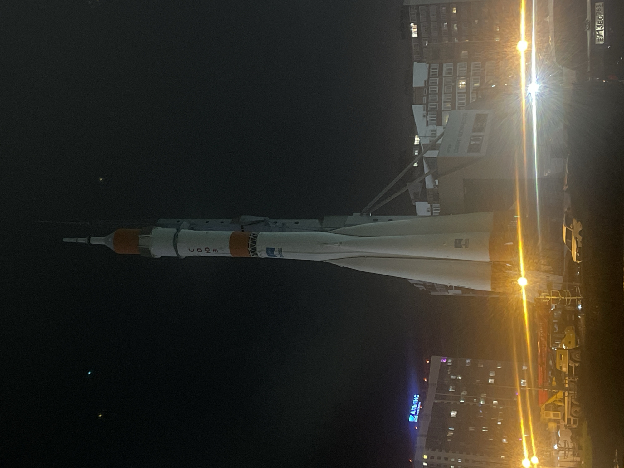 Soyuz rocket monument illuminated at night in Novokuybyshevsk