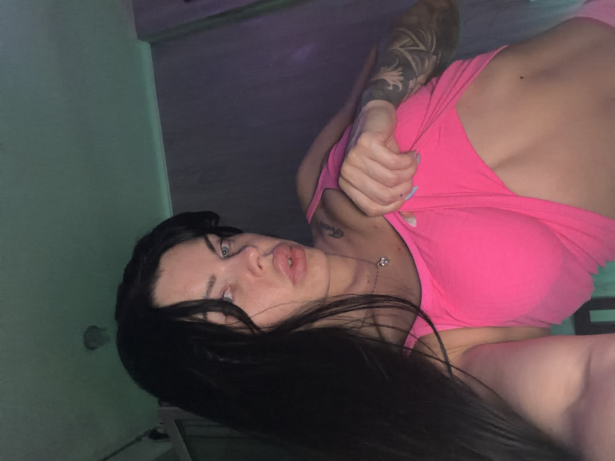 Dancing in colored lights inside a Ufa apartment