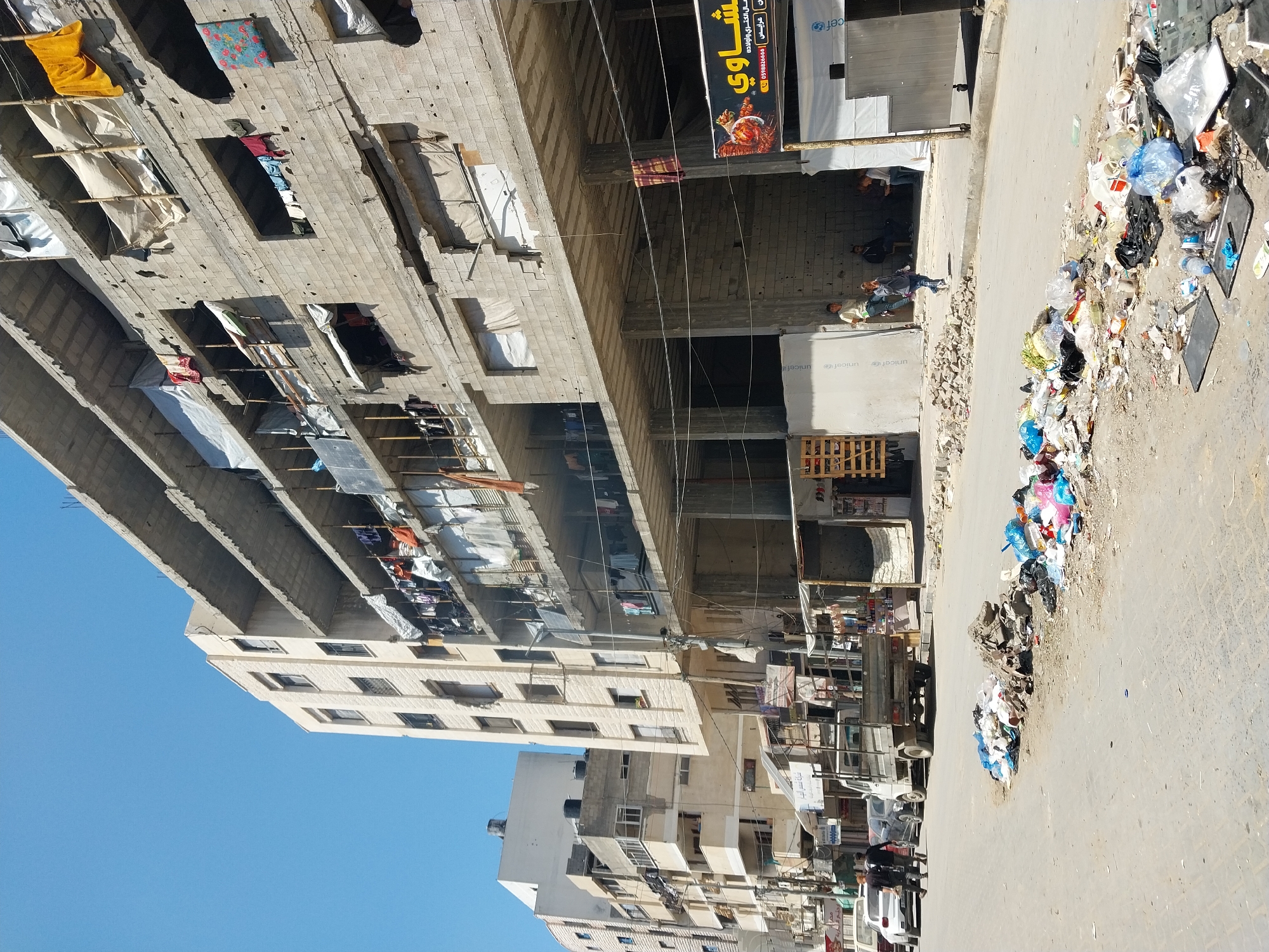 Daily life scenes documented across Gaza City streets and restaurants