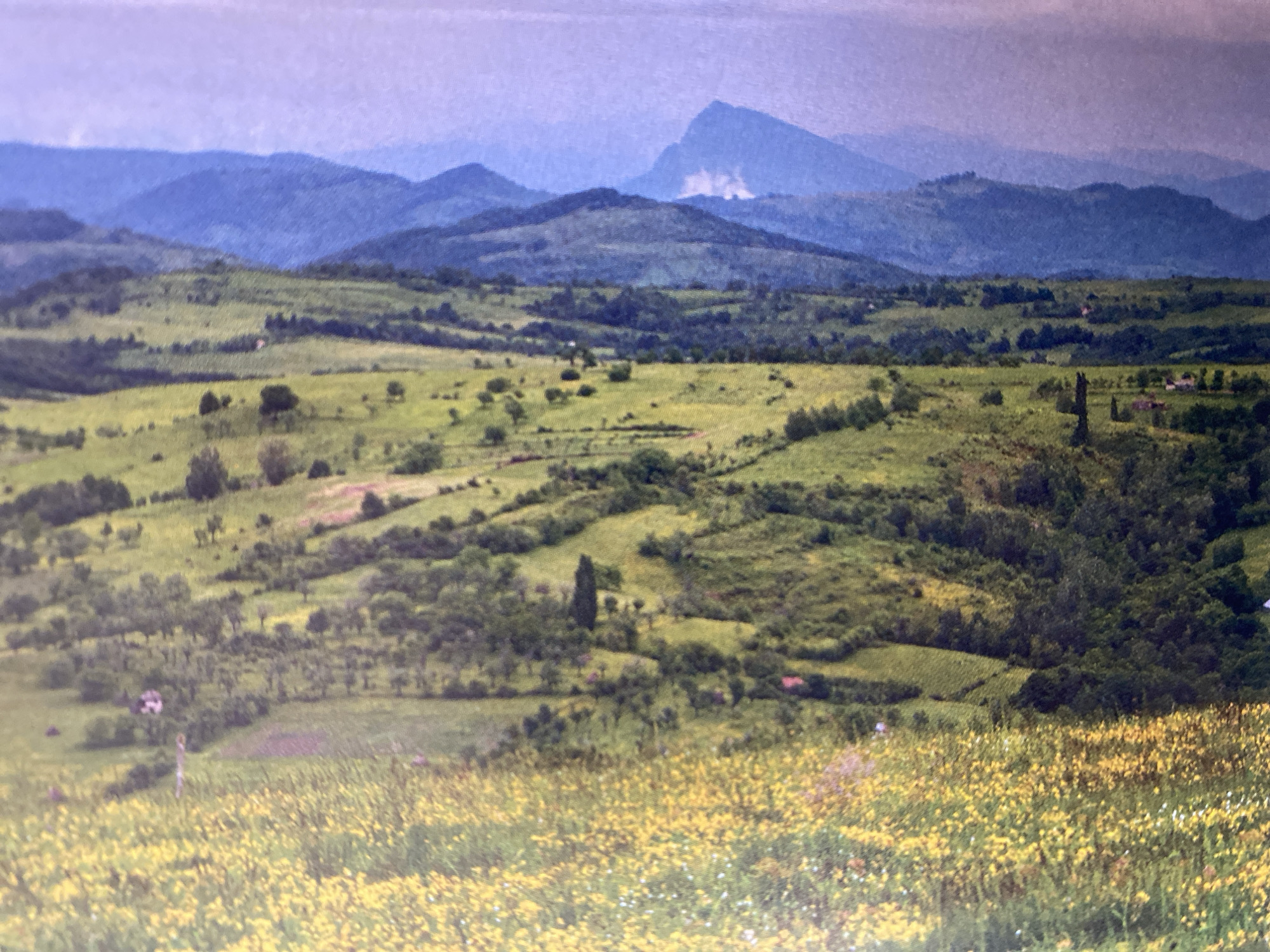 Mountain roads, rural landmarks, and green valleys on a summer morning